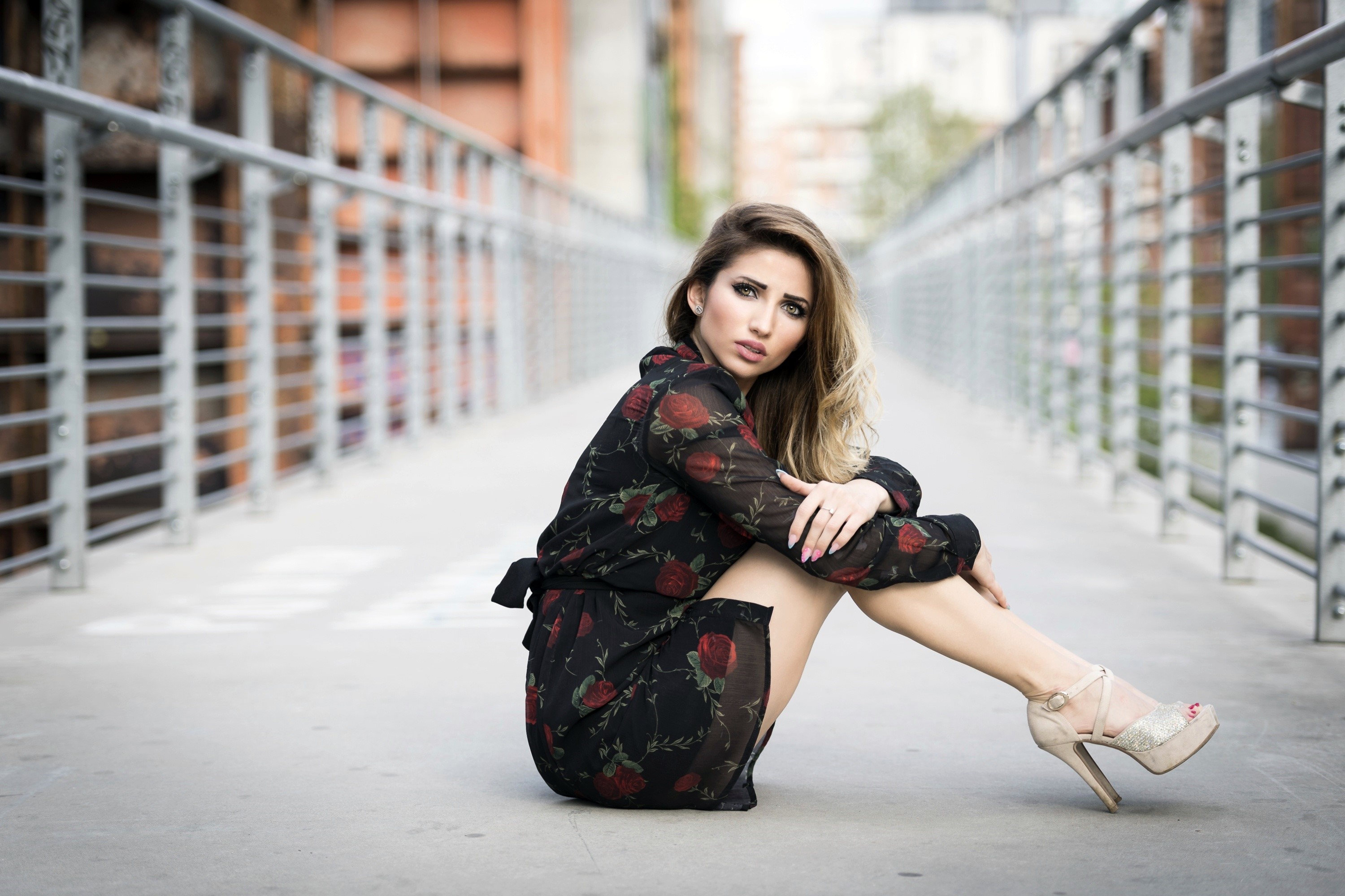 Woman in floral dress sitting on a bridge HD Wallpaper