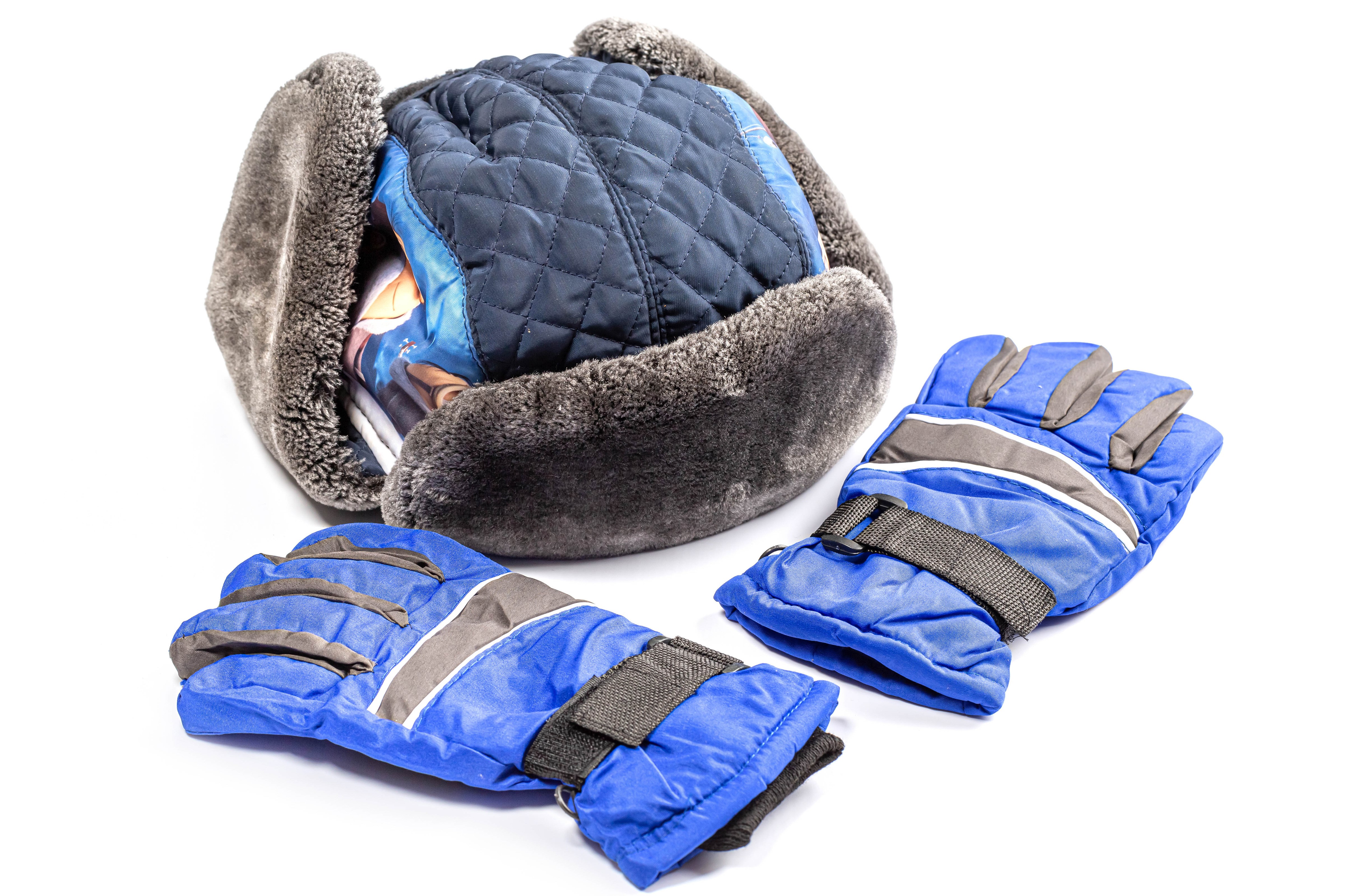 Winter hat and blue gloves on white background HD Wallpaper