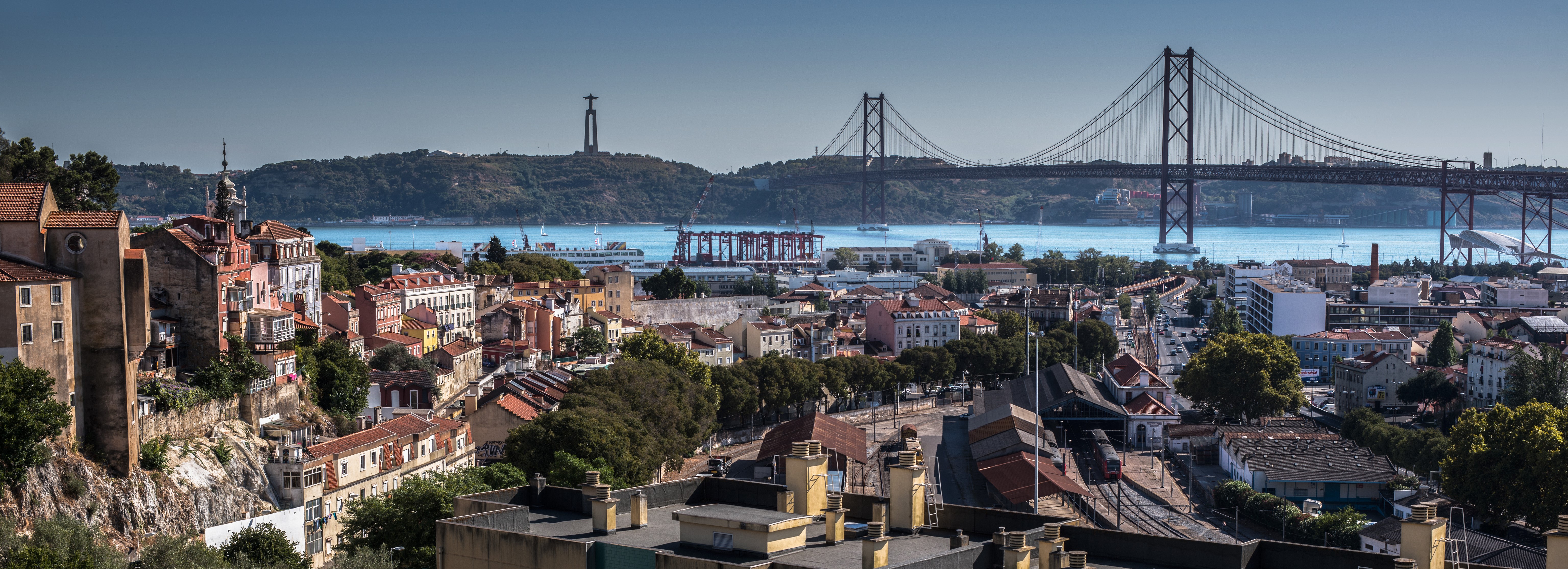 Lisbon Panorama with 25 de Abril Bridge and Christ the King Statue HD Wallpaper