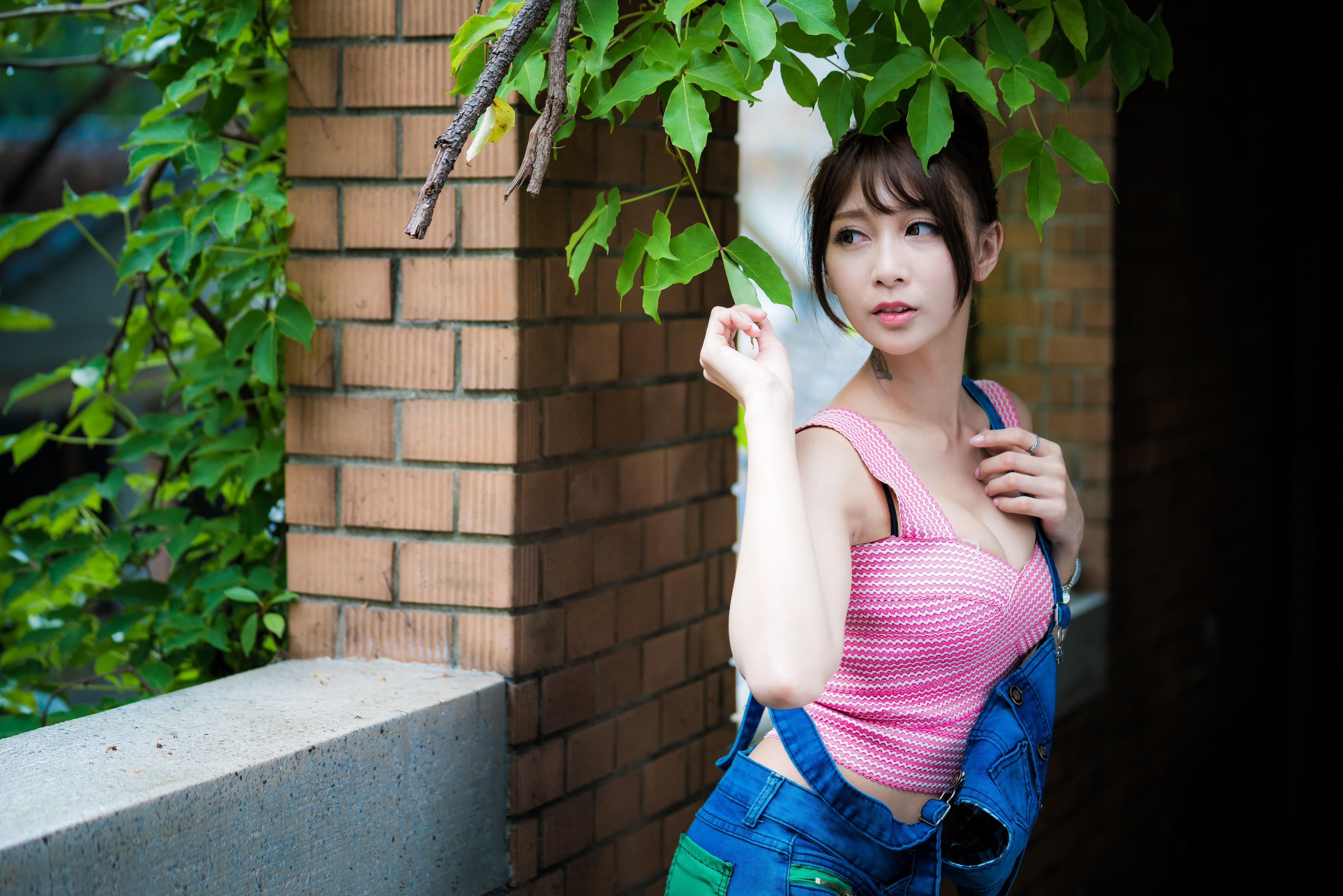 Asian woman in pink top and denim overalls HD Wallpaper