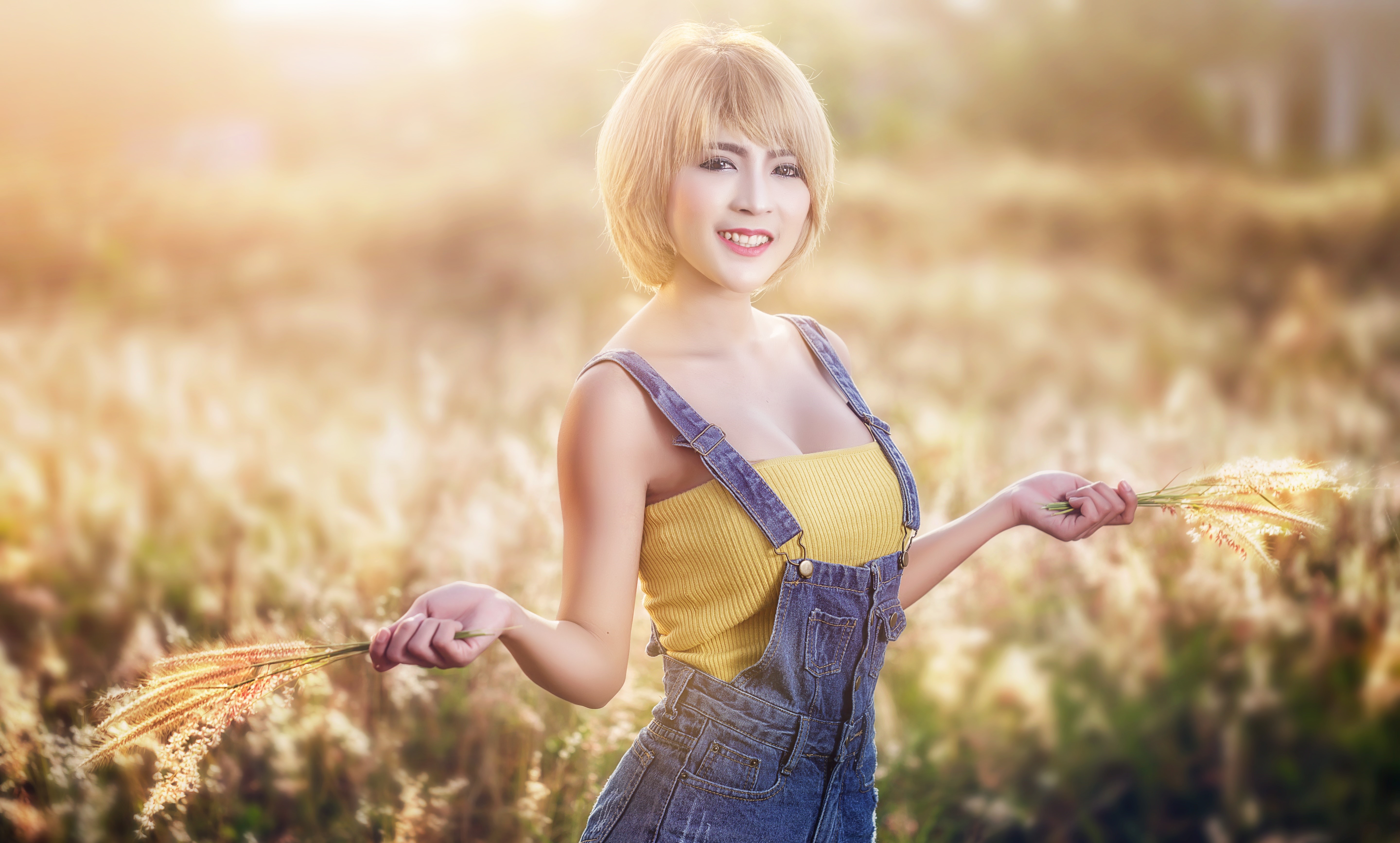 Blonde Asian girl in overalls holding grass HD Wallpaper