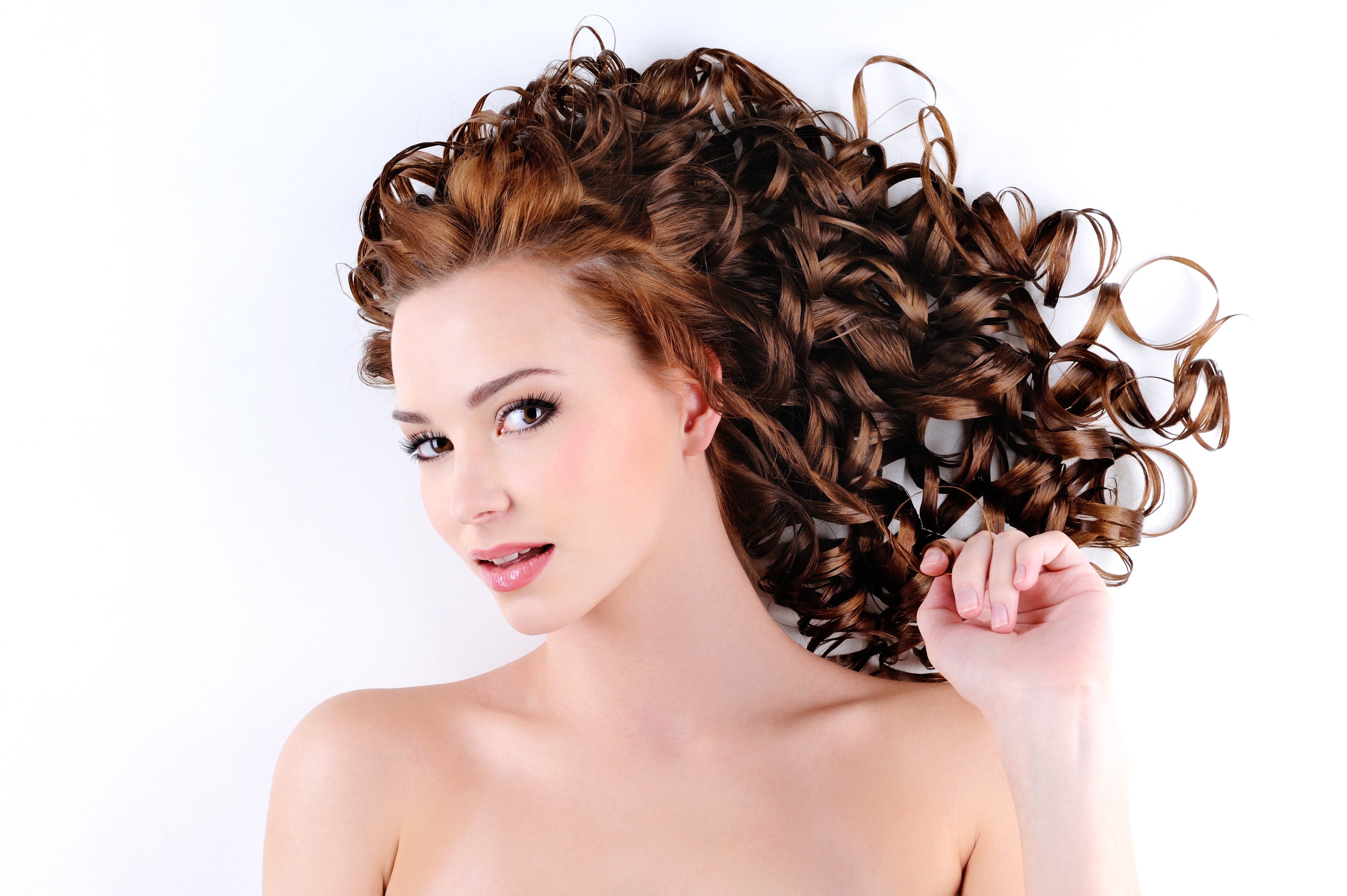 Brown haired woman with curly hairstyle on white background HD Wallpaper
