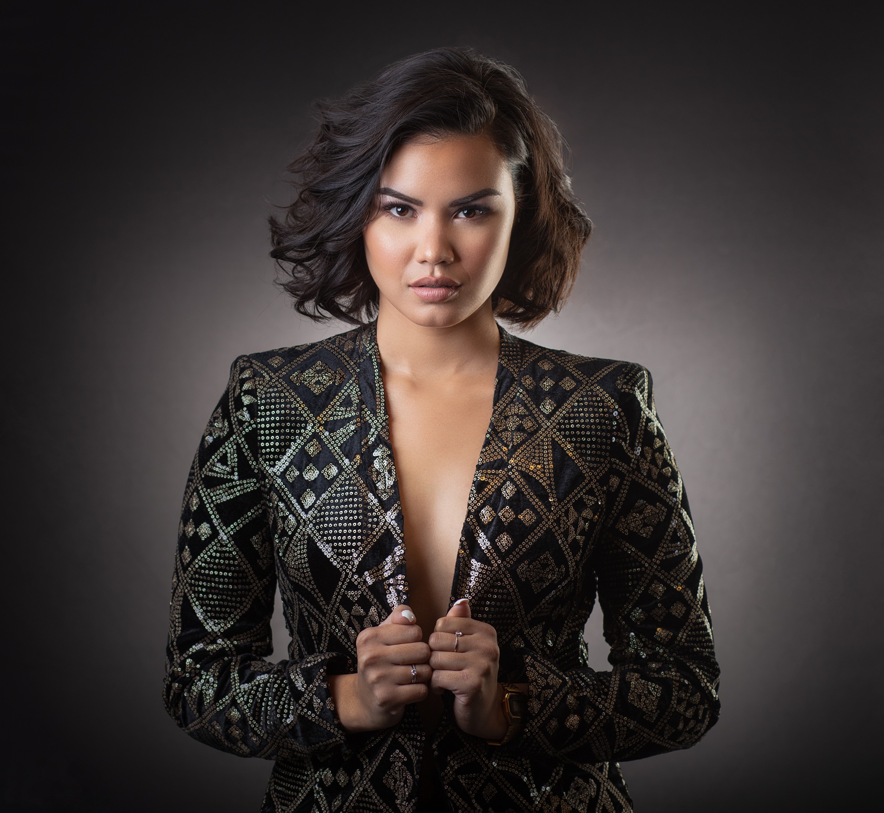 Elegant Woman in Patterned Suit Jacket HD Wallpaper