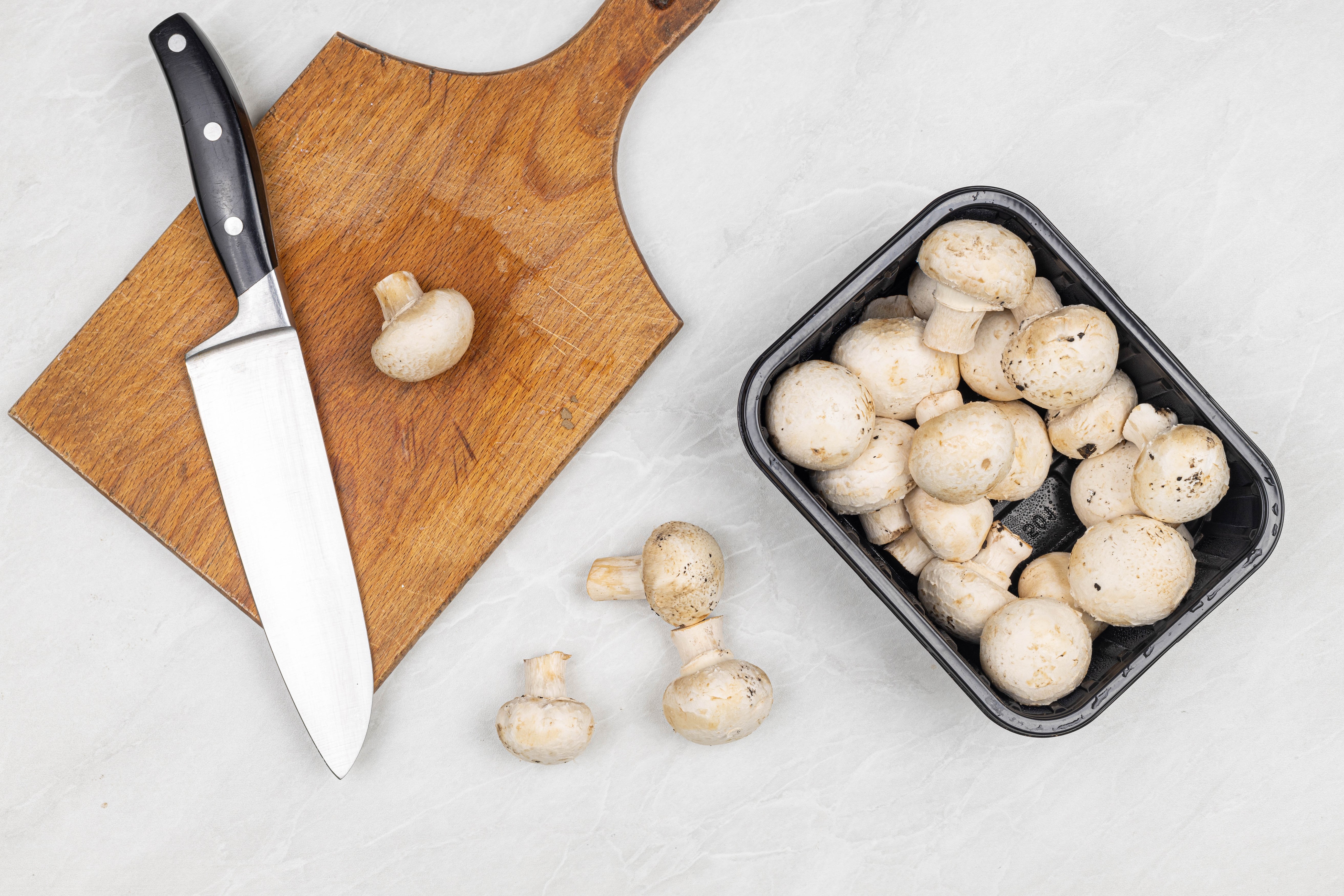 Mushrooms and Knife on Cutting Board HD Wallpaper