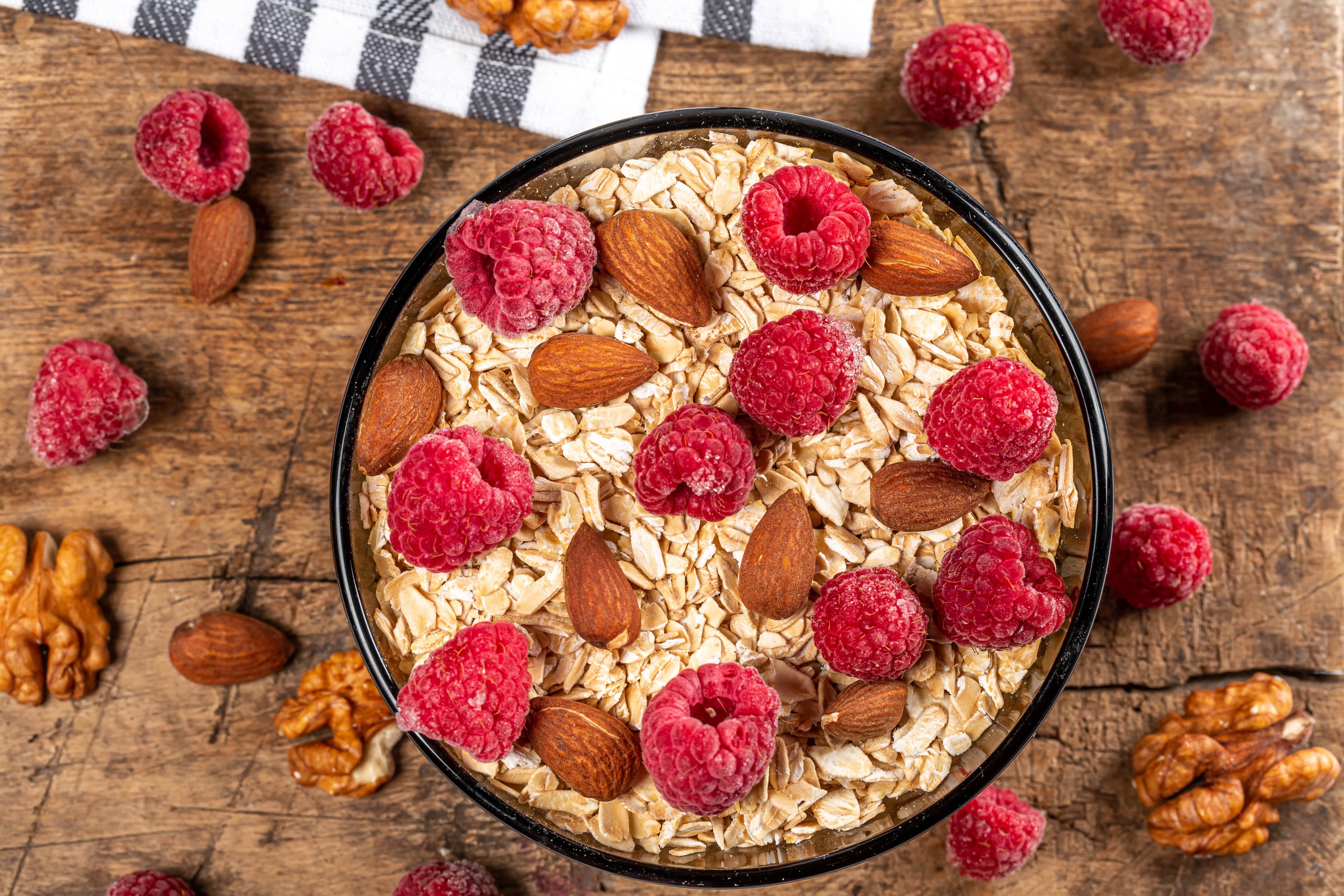 4K Oatmeal with Raspberries and Nuts HD Wallpaper
