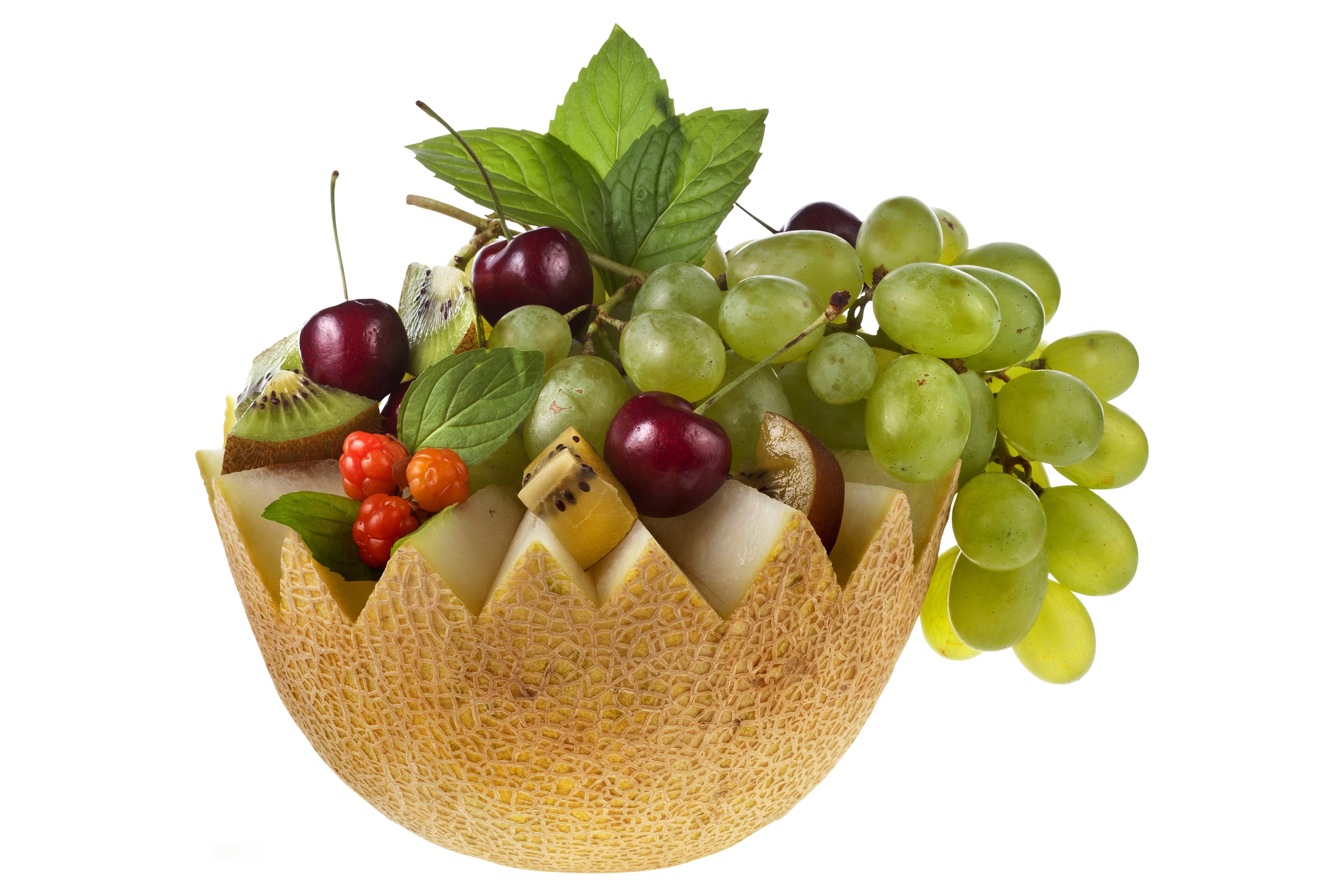 Fruit salad in a melon bowl with grapes, cherries, kiwi, and berries HD Wallpaper