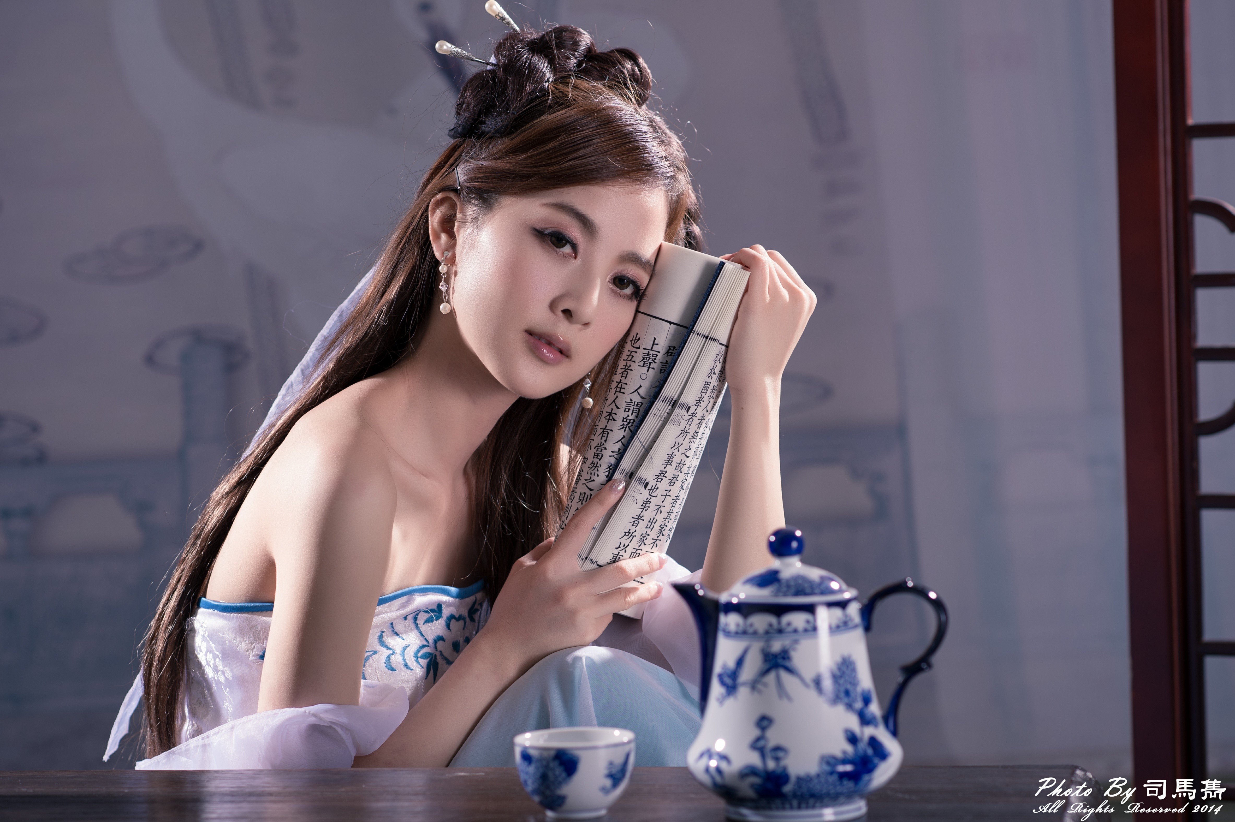 Asian woman in traditional dress holding a scroll HD Wallpaper