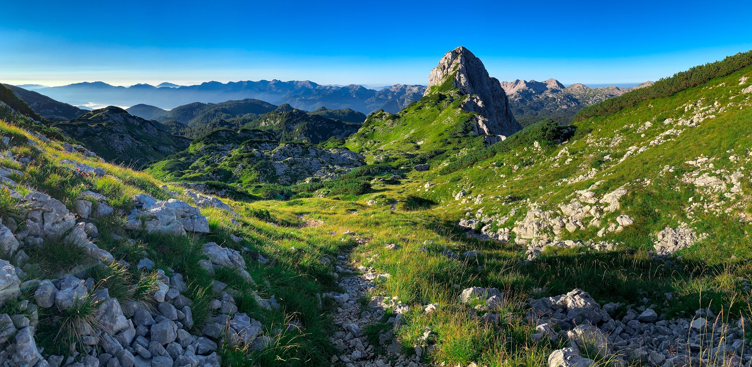 Mountain landscape with rocky path and peak in Slovenia HD Wallpaper