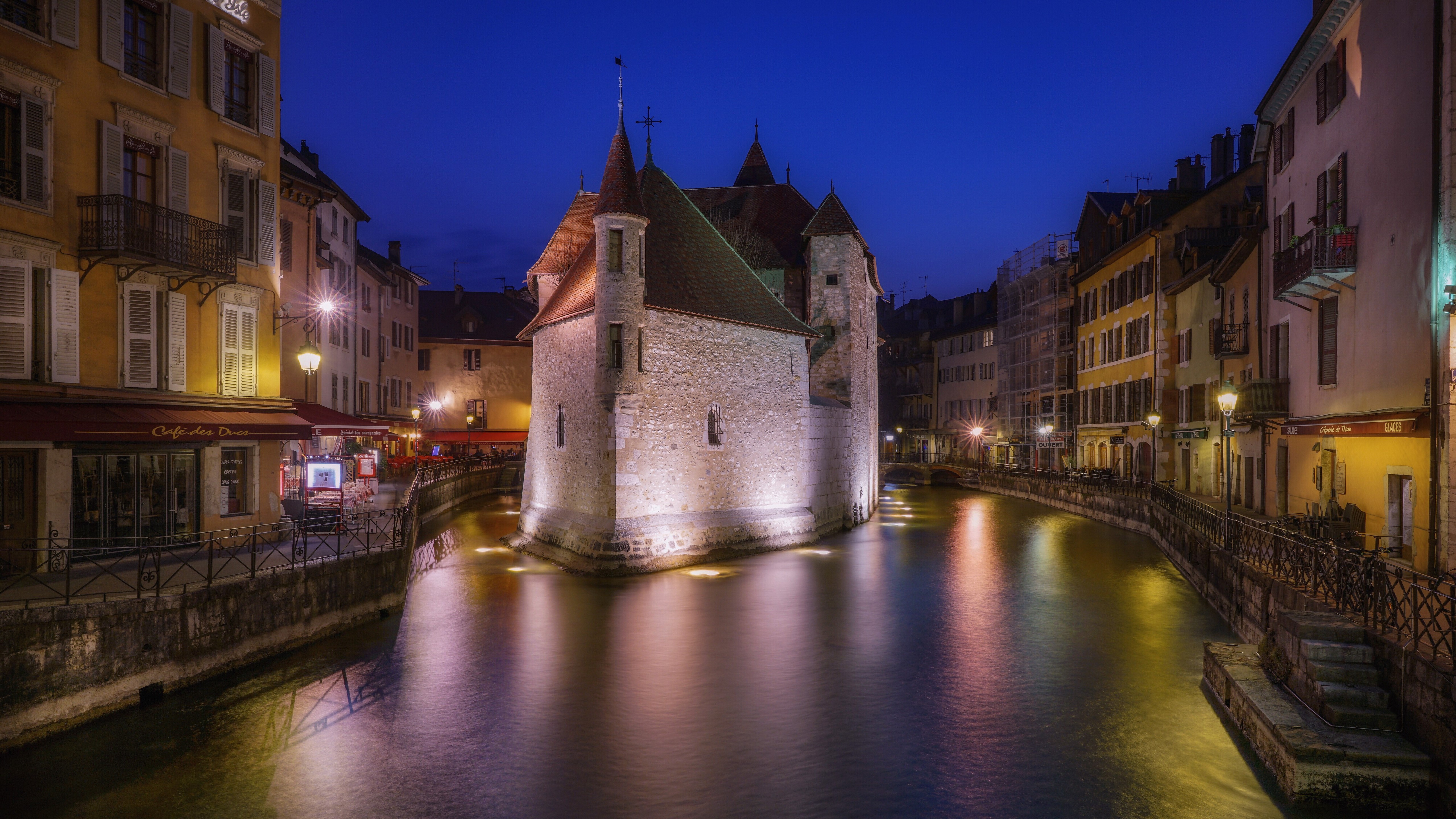 Palais de l'Isle on a canal at night in Annecy, France HD Wallpaper