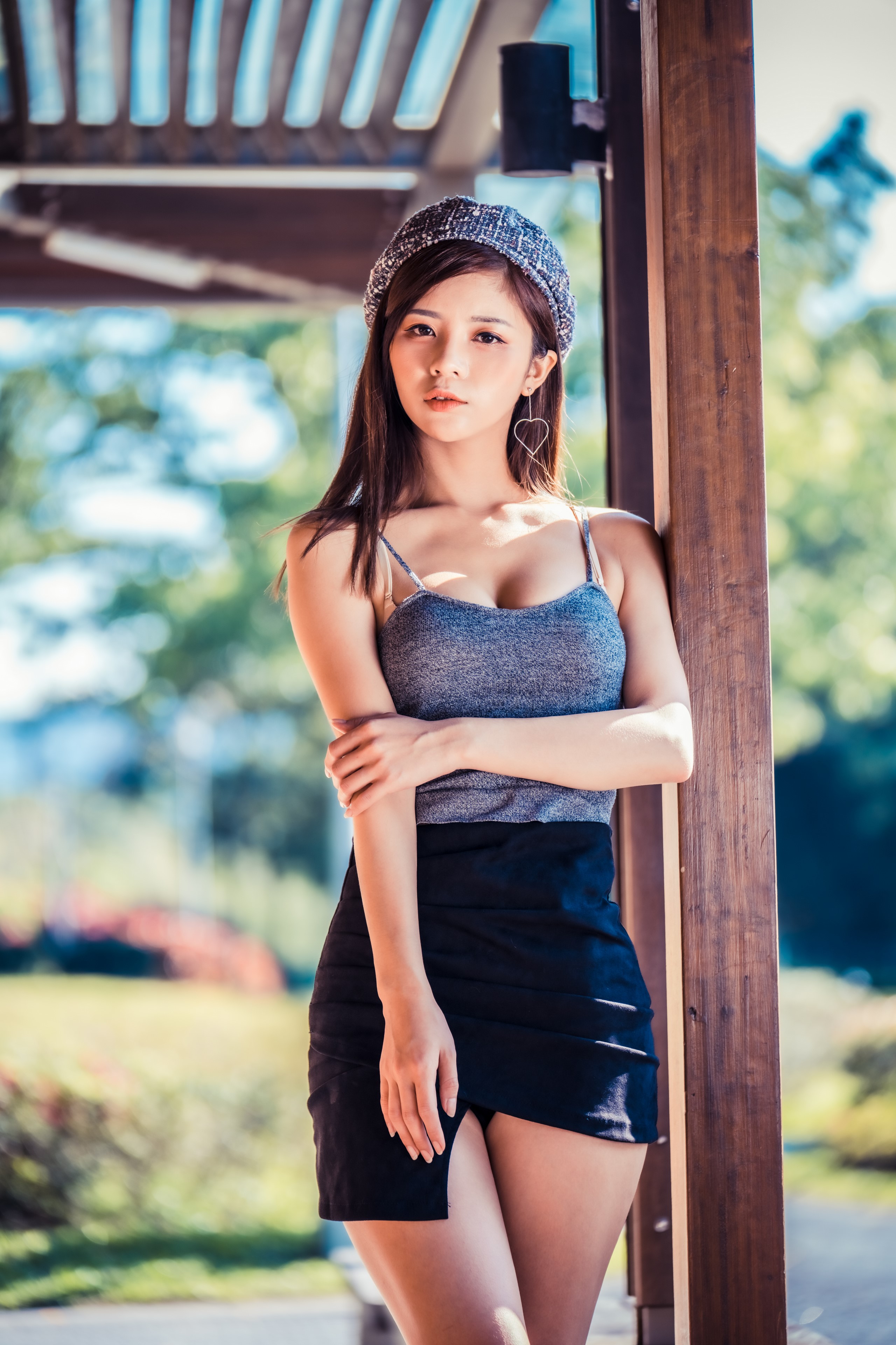 Elegant Asian Woman in Skirt and Beret HD Phone Wallpaper