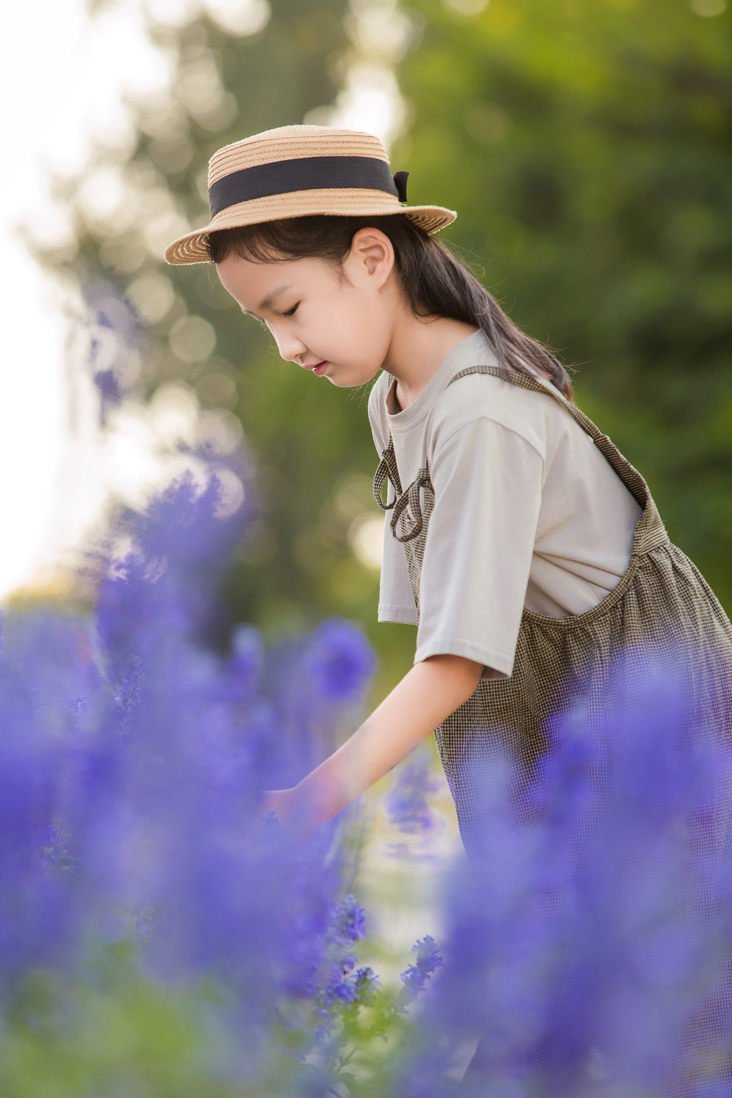 Young Asian Girl in Hat Among Purple Flowers HD Phone Wallpaper