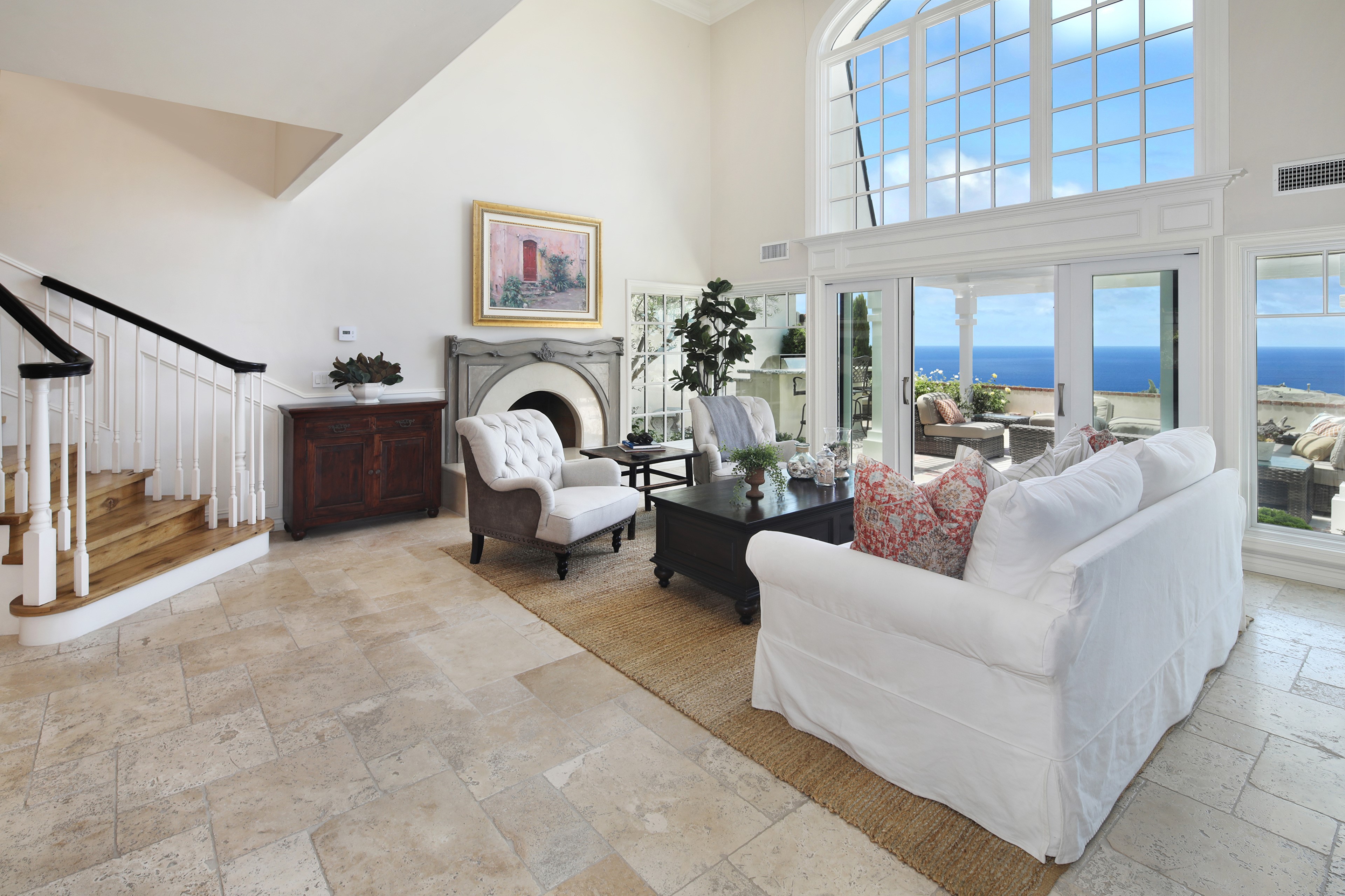 Living room with fireplace and ocean view HD Wallpaper