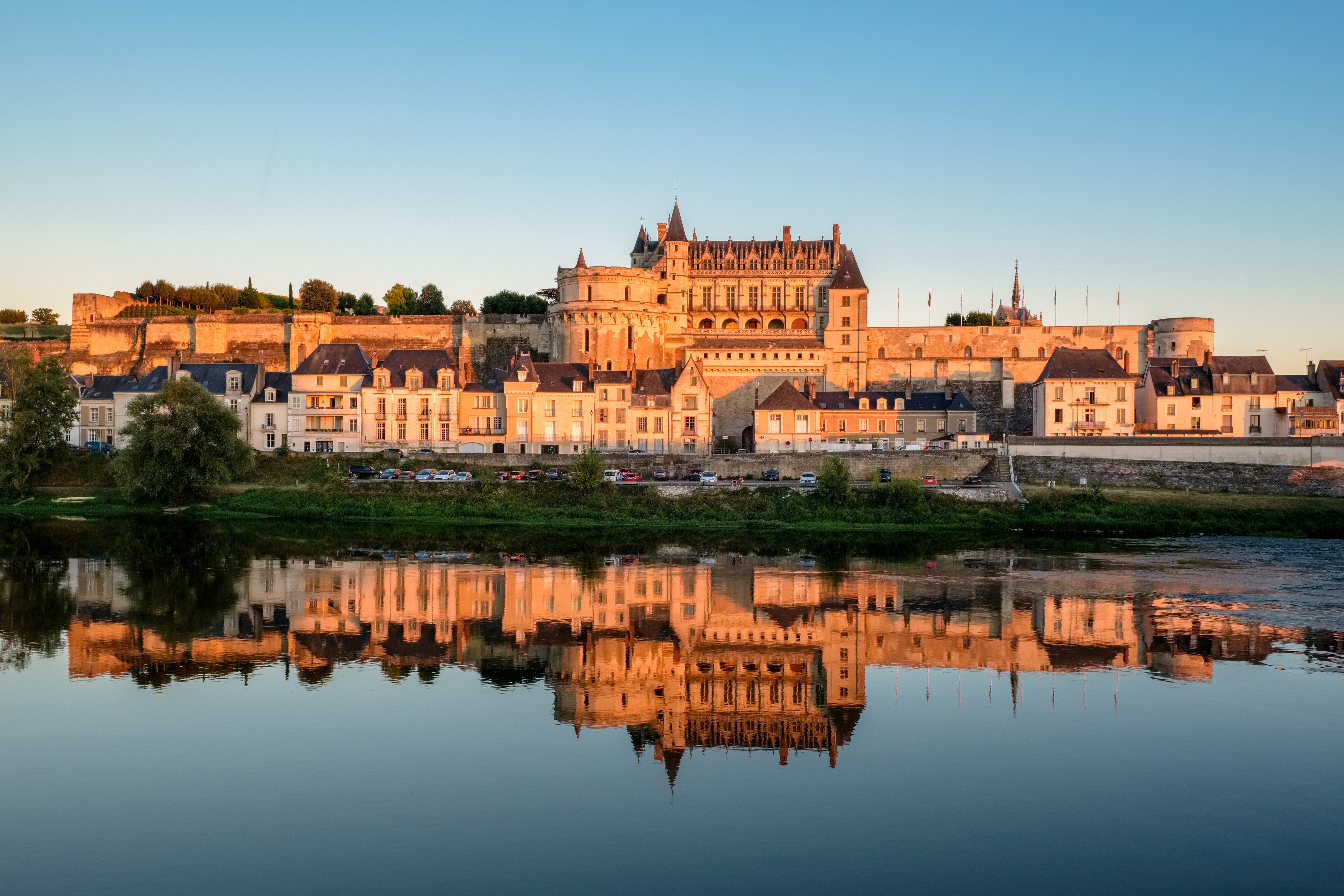 Amboise Castle reflected in a river at sunset, France HD Wallpaper