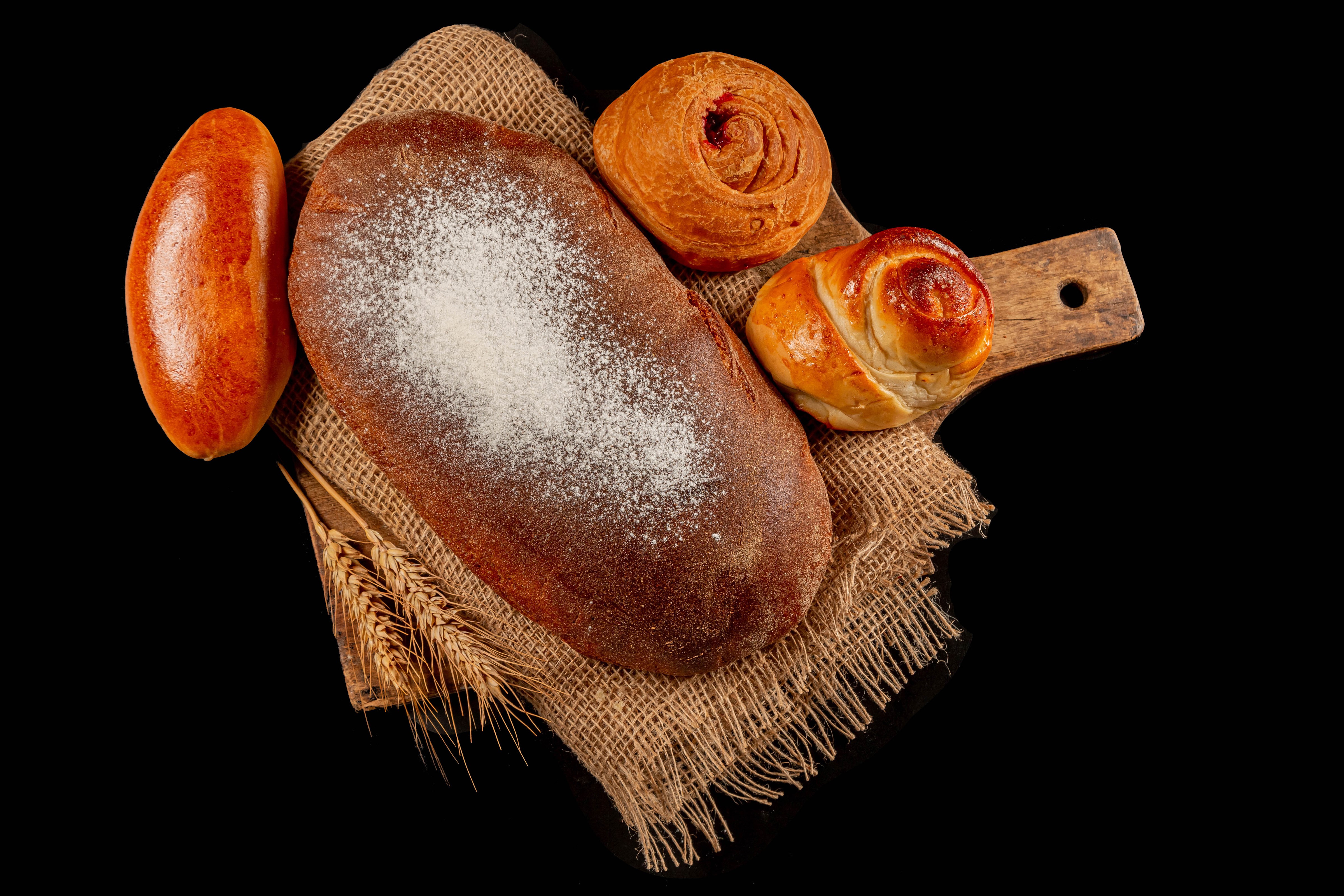 Assortment of Baked Goods on Black Background HD Wallpaper