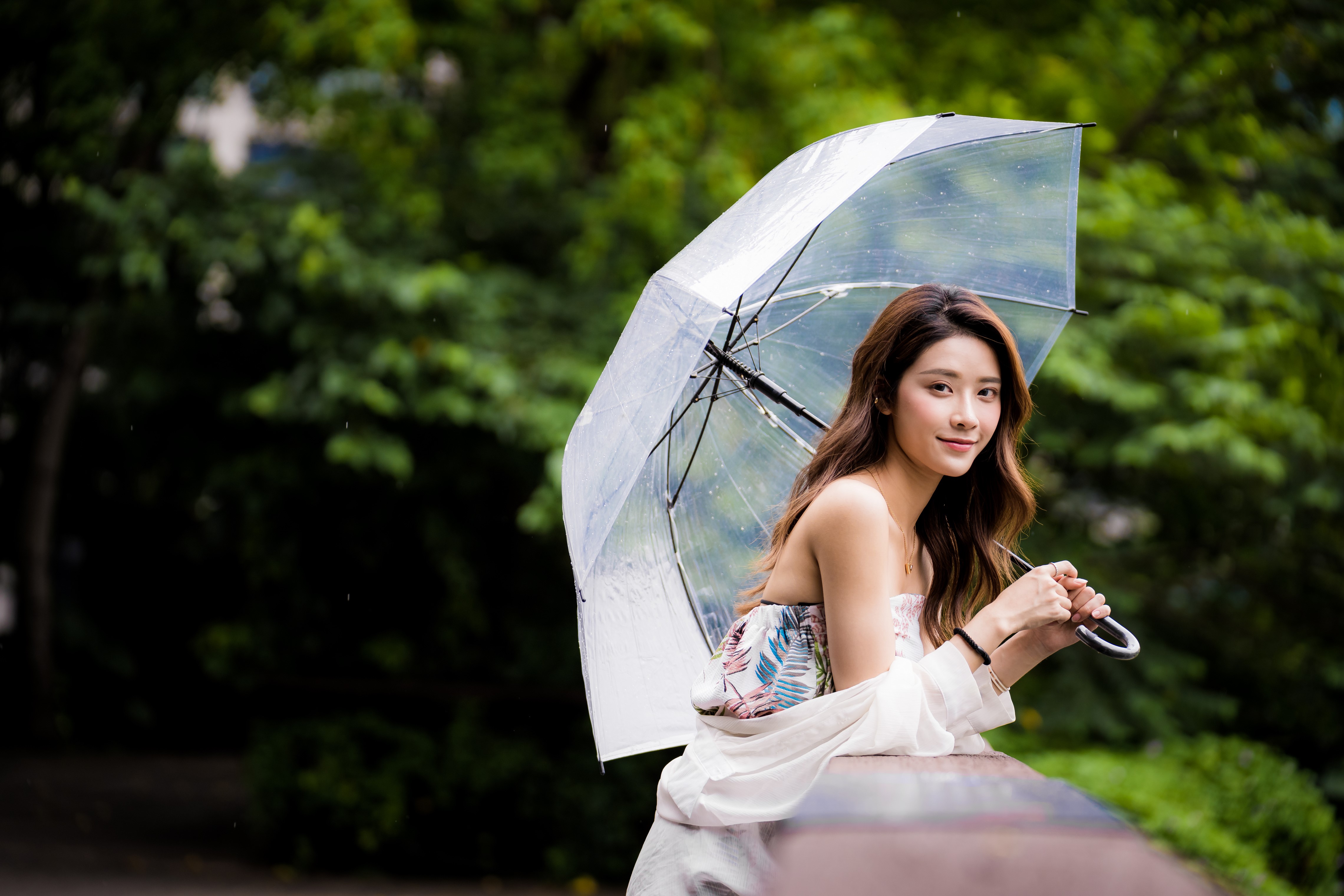 Asian woman with brown hair holding an umbrella HD Wallpaper