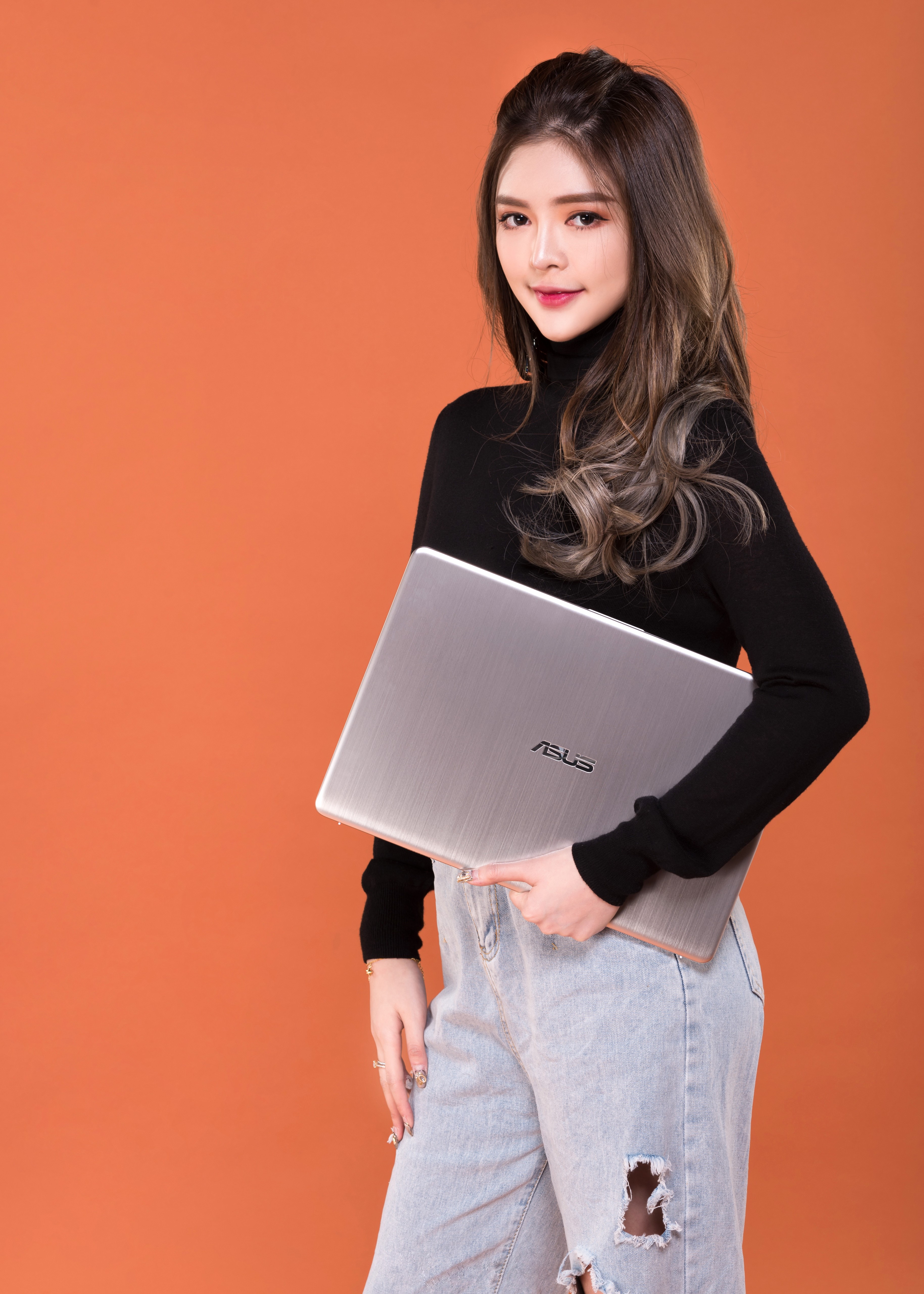 Asian woman holding an Asus laptop HD Phone Wallpaper