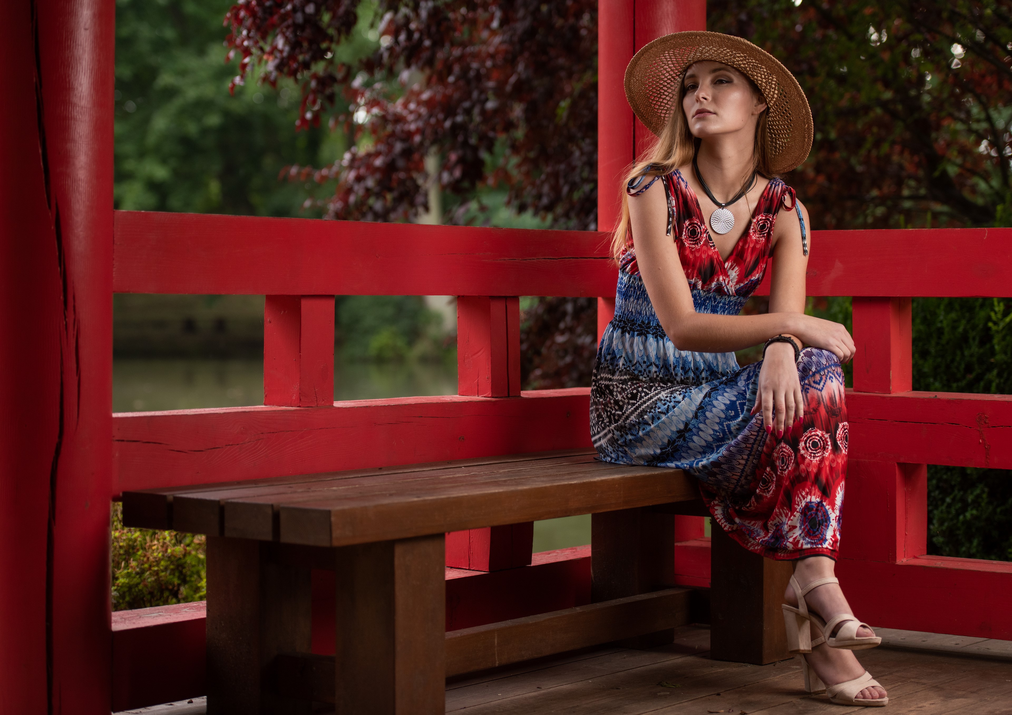 Woman in Dress and Hat Sitting on Bench HD Wallpaper
