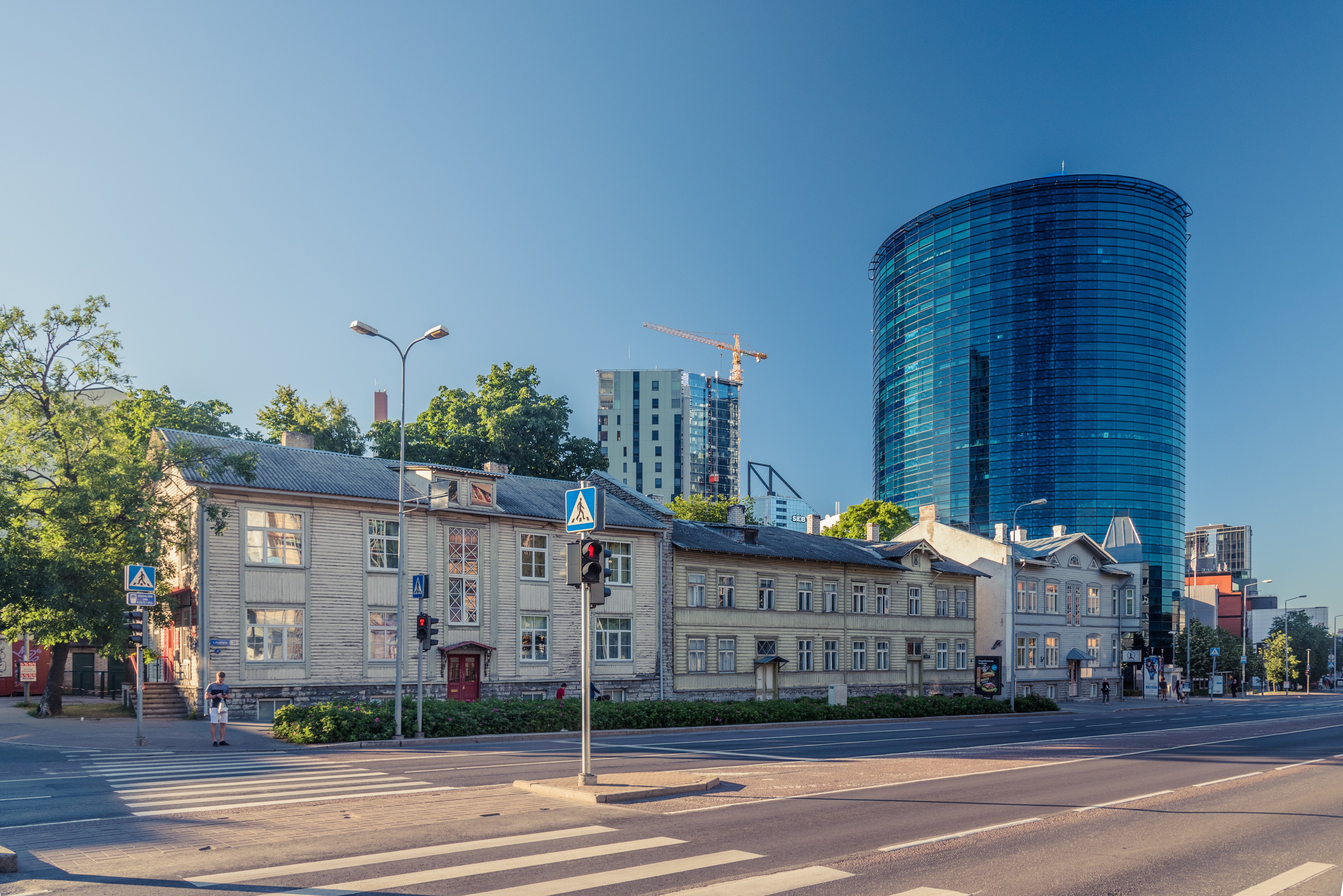 Houses and modern skyscraper in Tallinn, Estonia HD Wallpaper