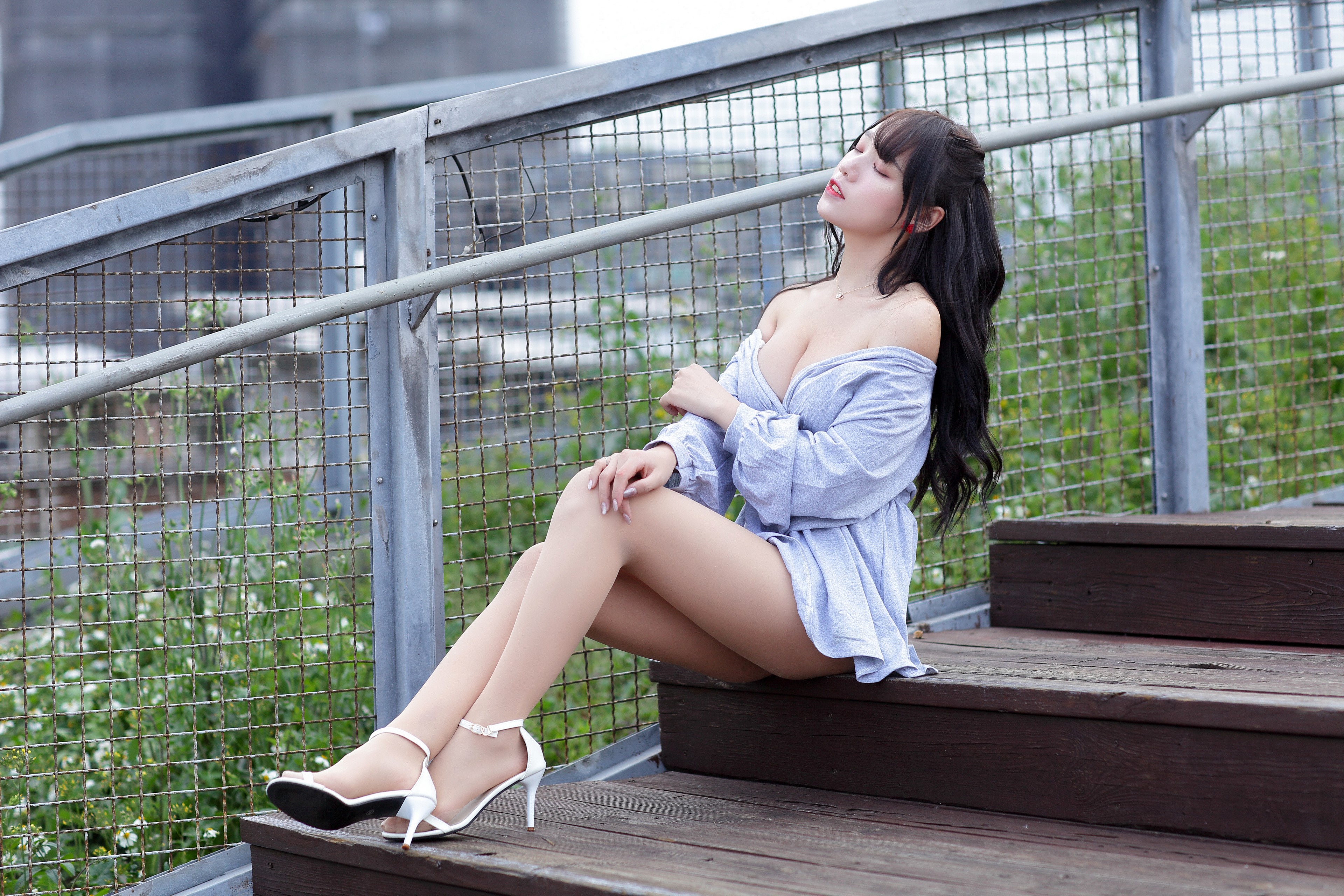 Asian woman sitting on steps HD Wallpaper