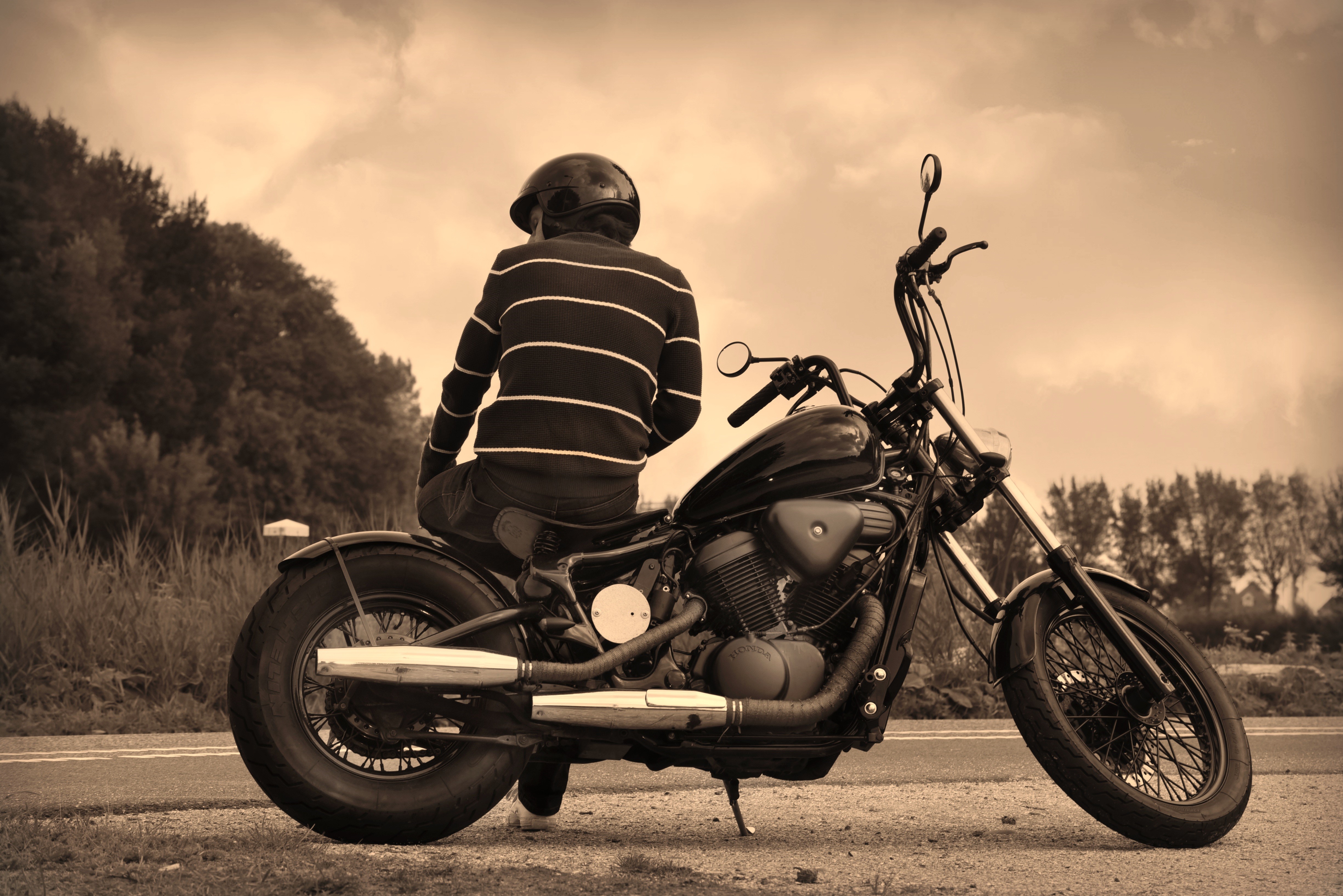 Man in helmet sitting on motorcycle HD Wallpaper