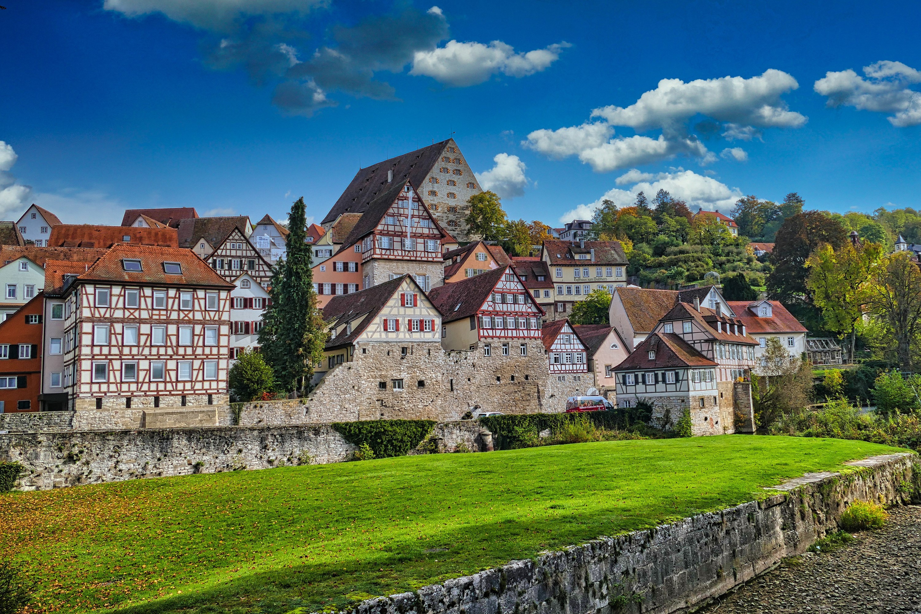 Half-timbered houses in a German town with a green lawn HD Wallpaper
