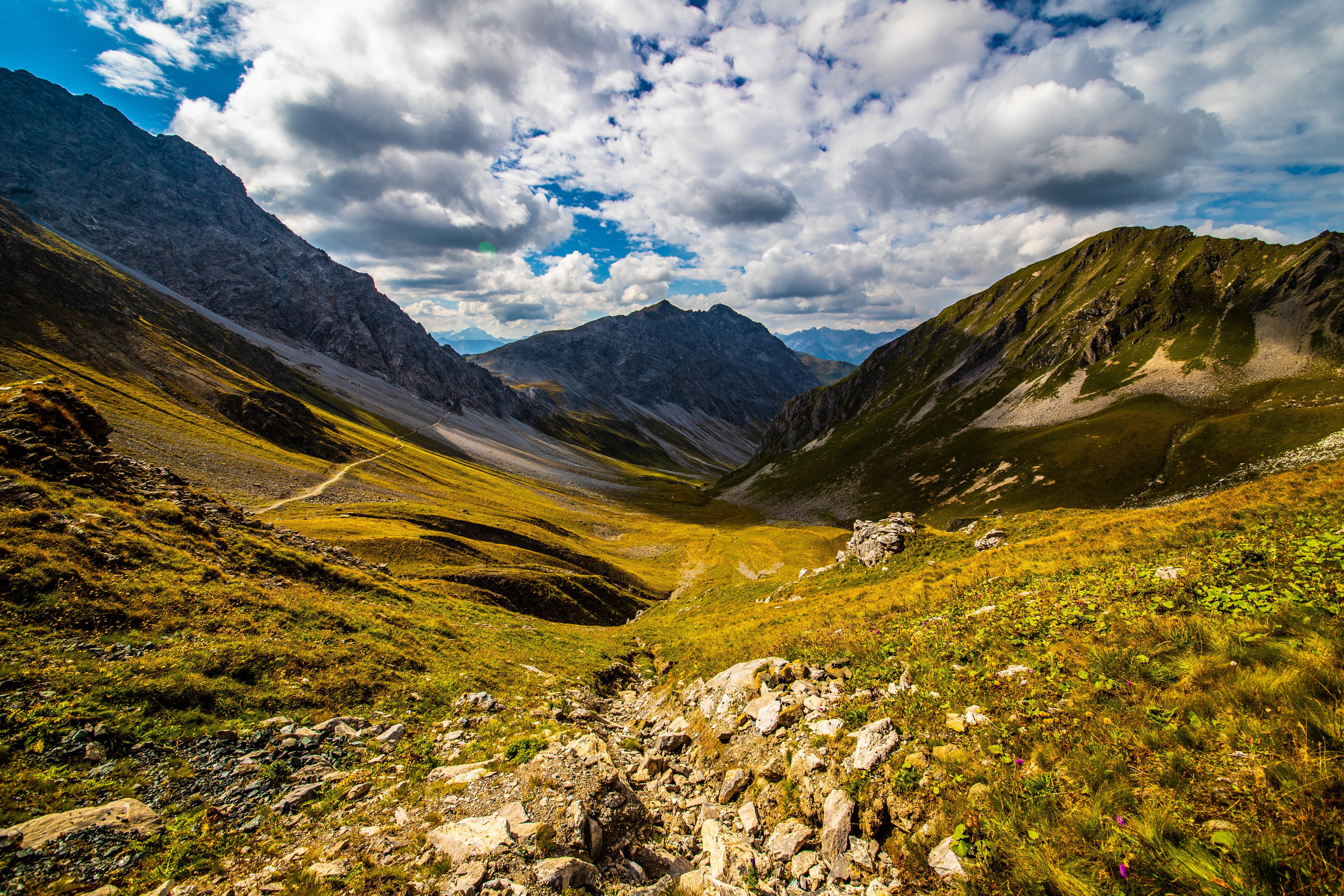 Valley in the Swiss Alps with Mountains and Clouds HD Wallpaper