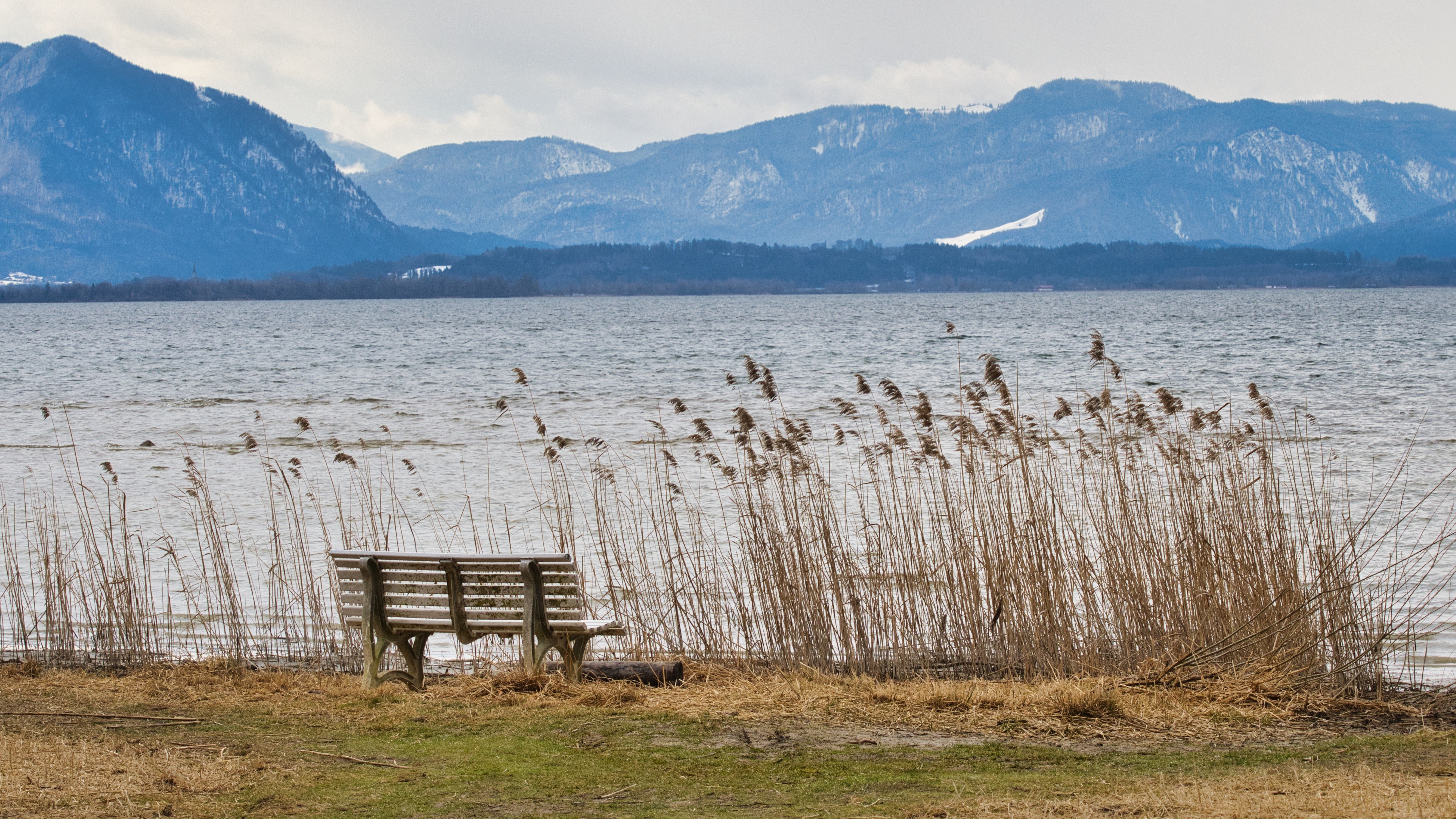 Bench by a lake with mountains in Bavaria, Germany HD Wallpaper