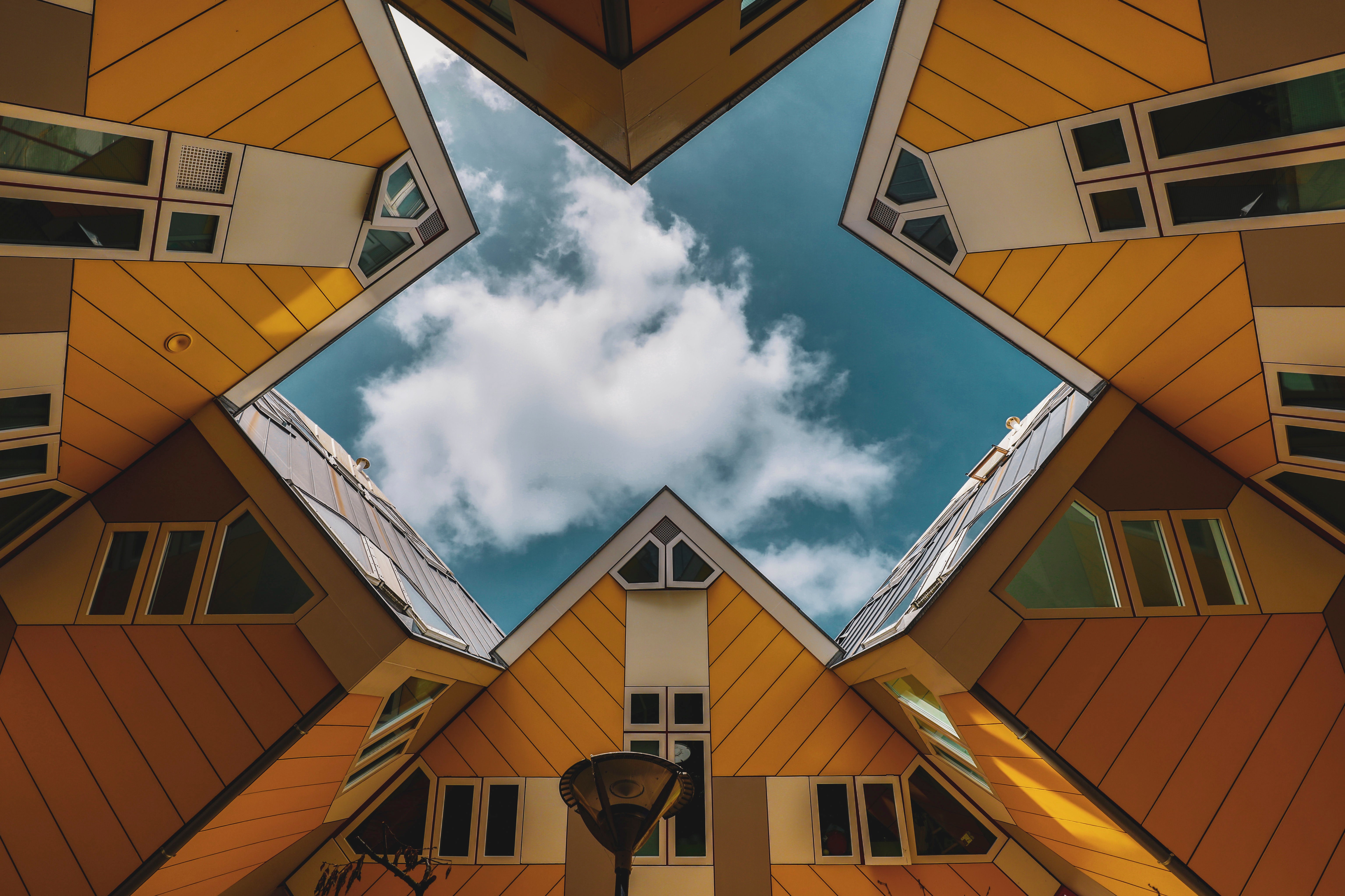 Cube Houses in Rotterdam, Netherlands, against a cloudy sky HD Wallpaper