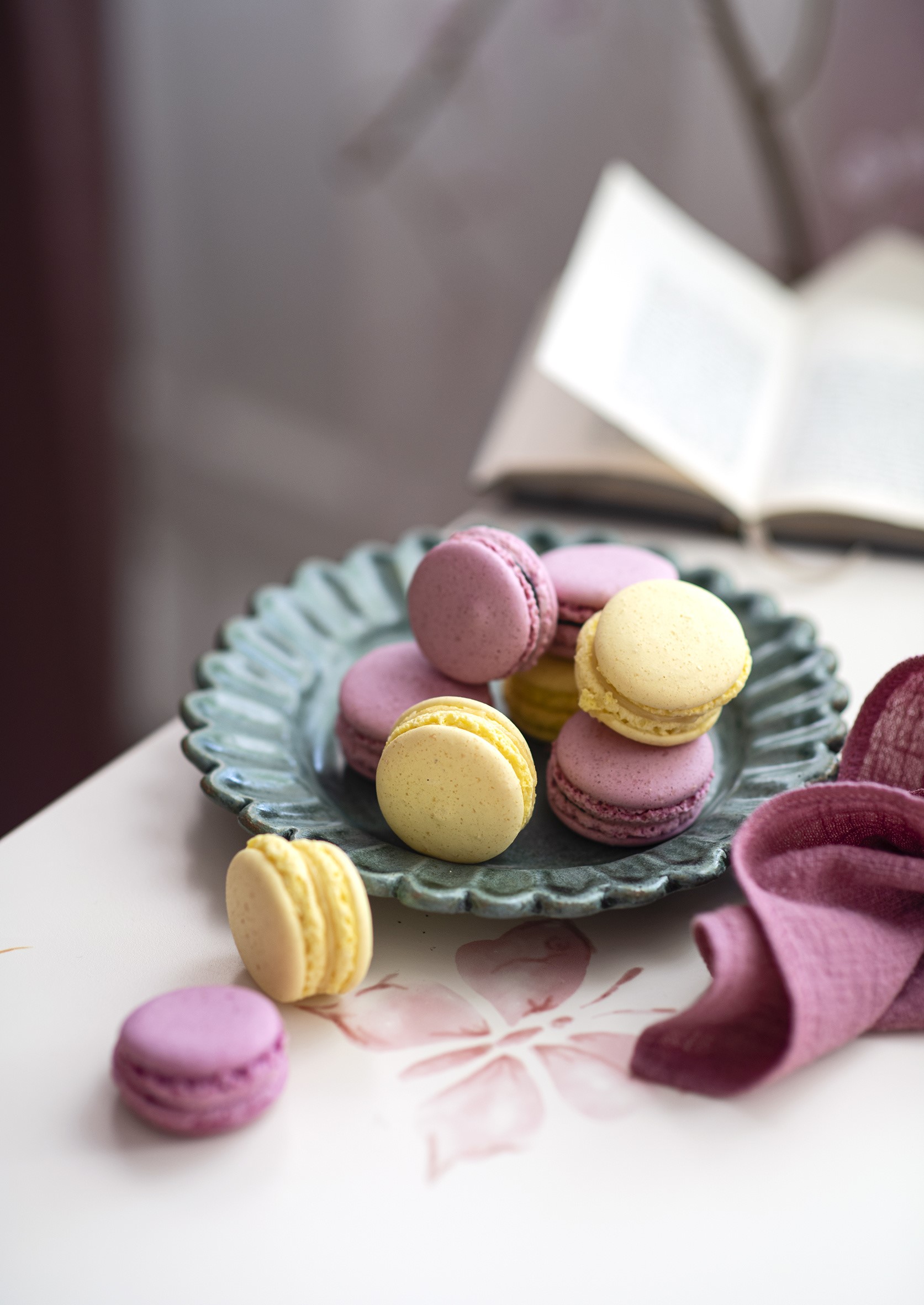 Pink and yellow macarons on a plate HD Phone Wallpaper