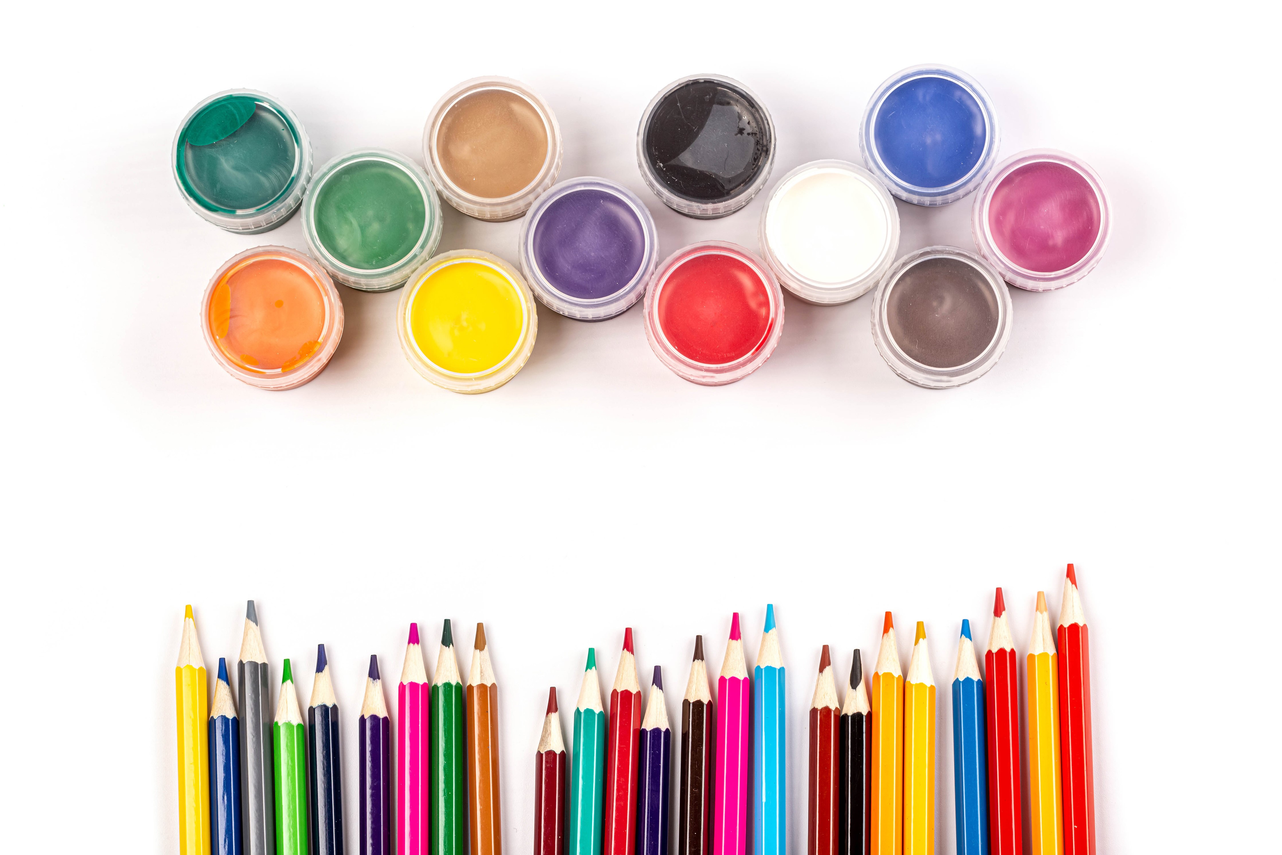 Multicolor paint pots and pencils on white background HD Wallpaper