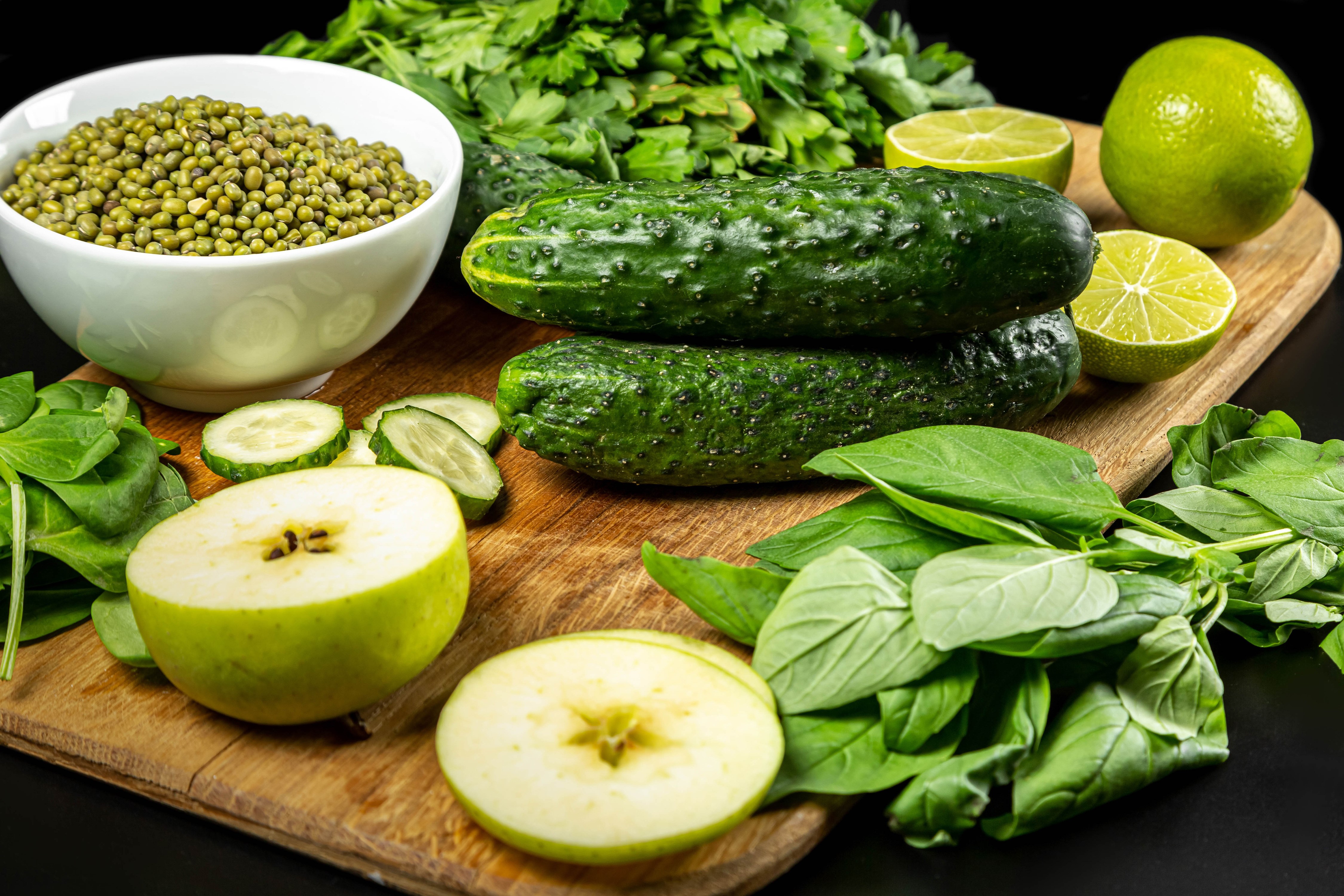 4K Vegetables with Cucumbers, Apples, Green Peas, and Lime on Cutting Board HD Wallpaper