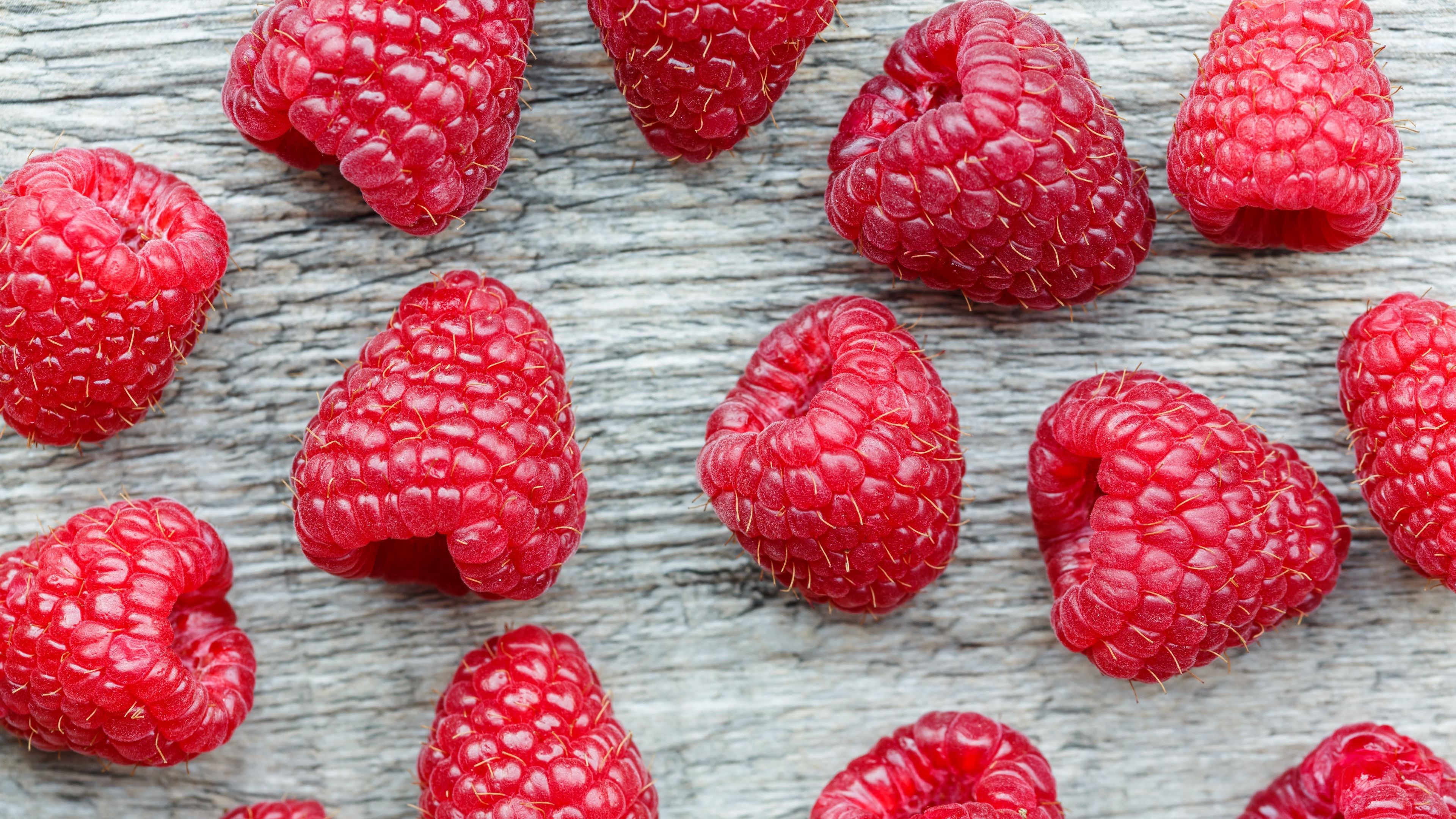 Raspberries on a wooden surface HD Wallpaper