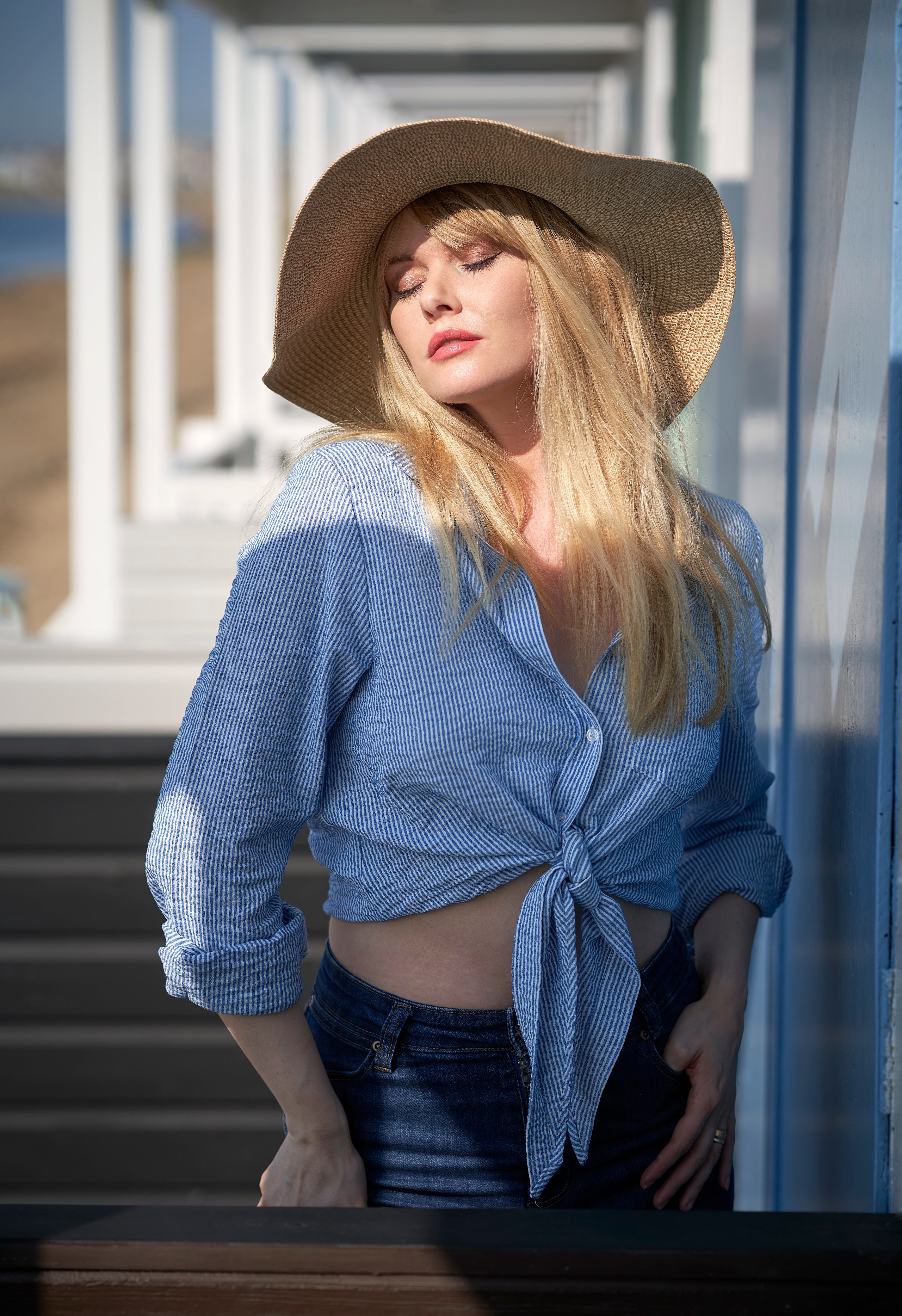 Woman in straw hat and blue striped shirt HD Phone Wallpaper