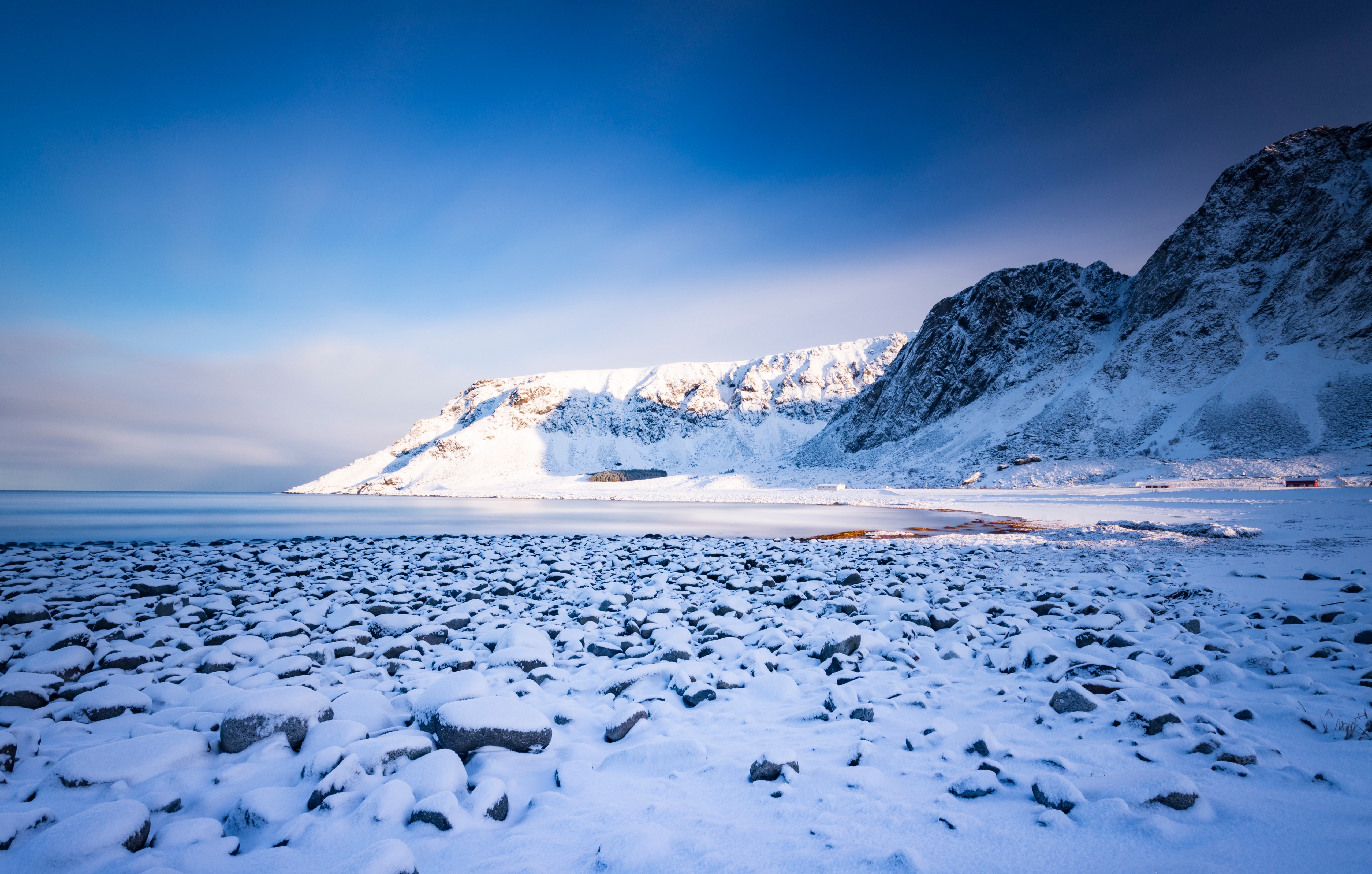 Snowy Mountains and Rocky Beach in Lofoten, Norway HD Wallpaper