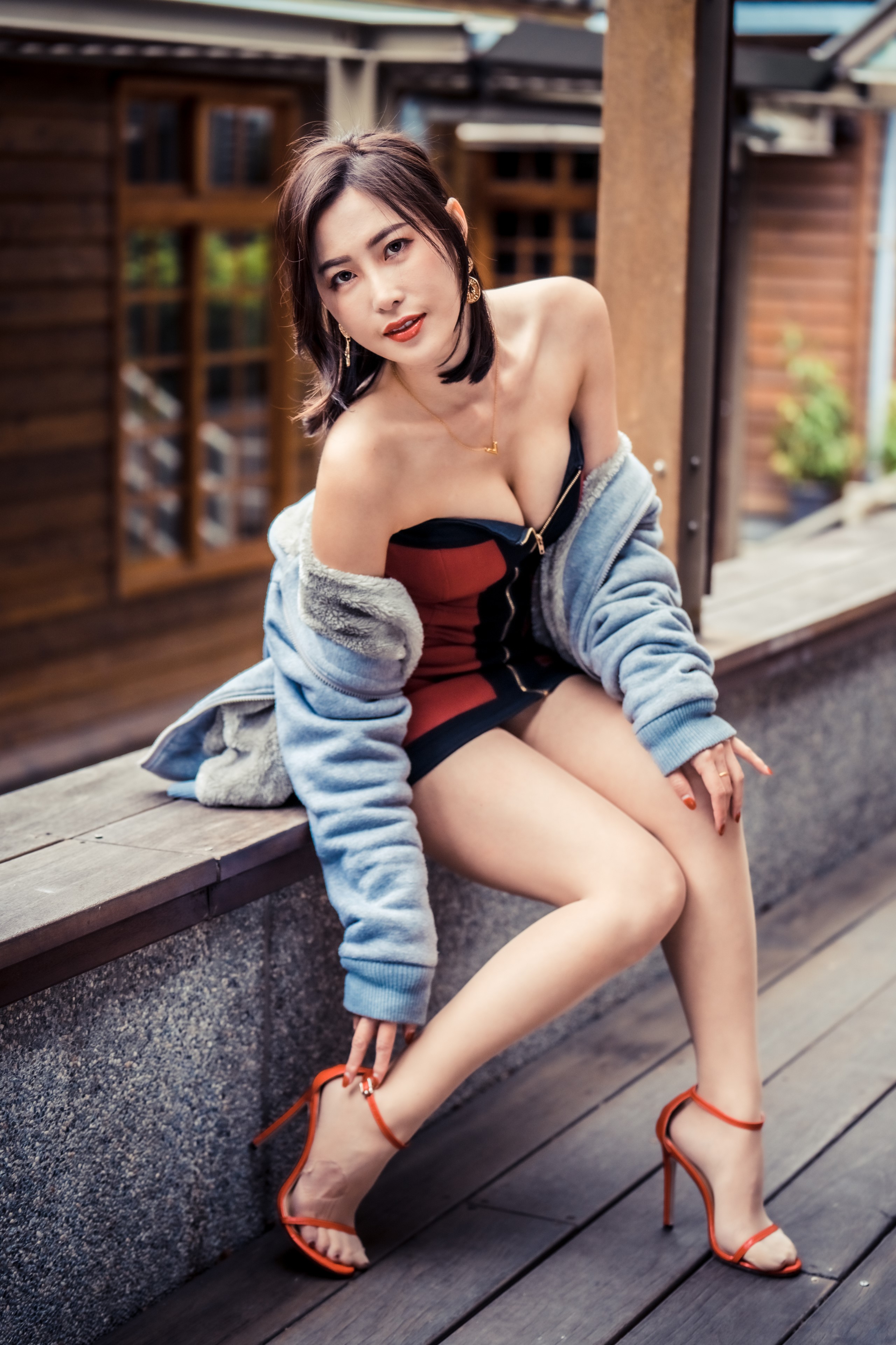 Asian Woman Sitting in Stylish Dress and Heels HD Phone Wallpaper