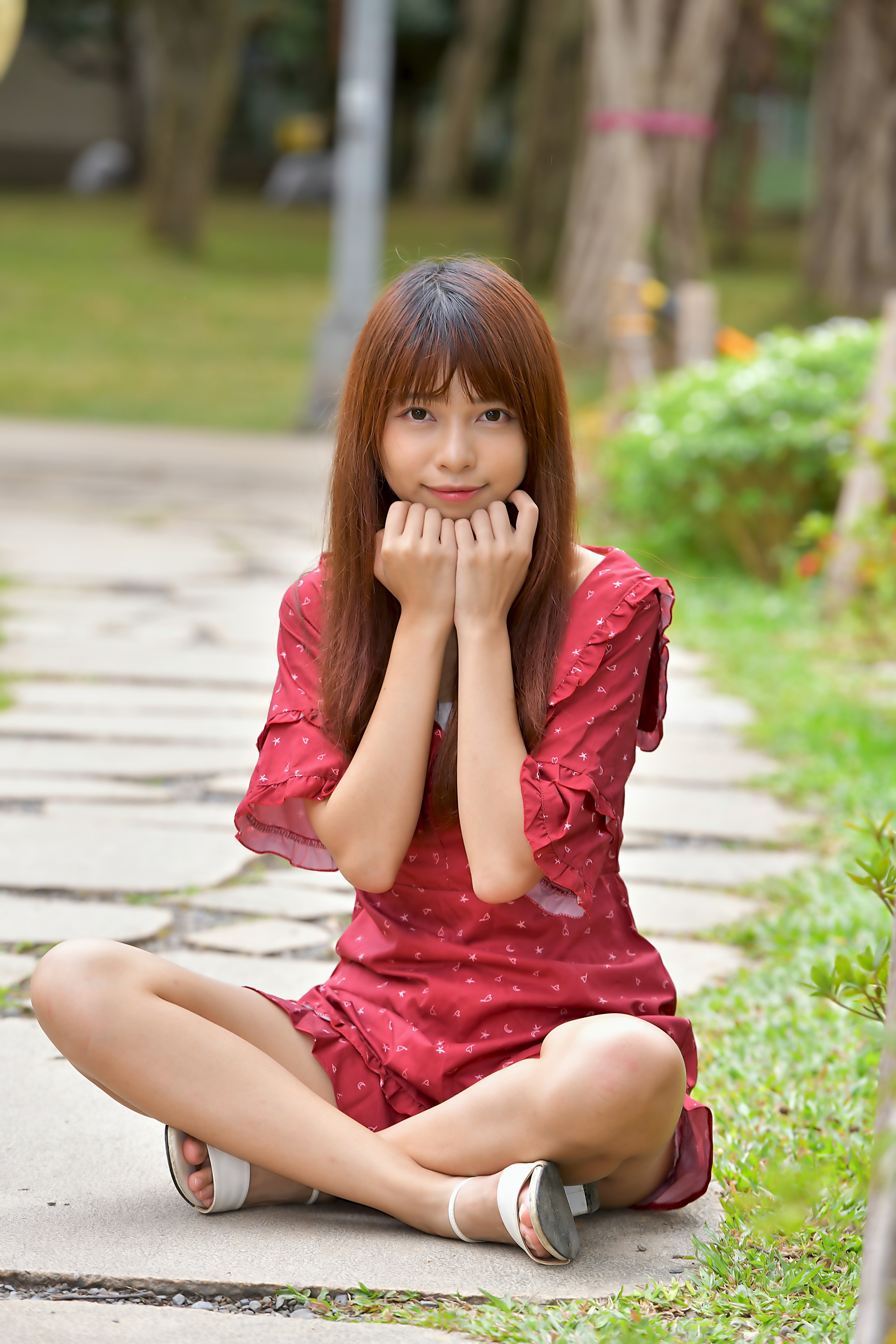 Asian Woman Sitting in Red Dress Outdoors HD Phone Wallpaper
