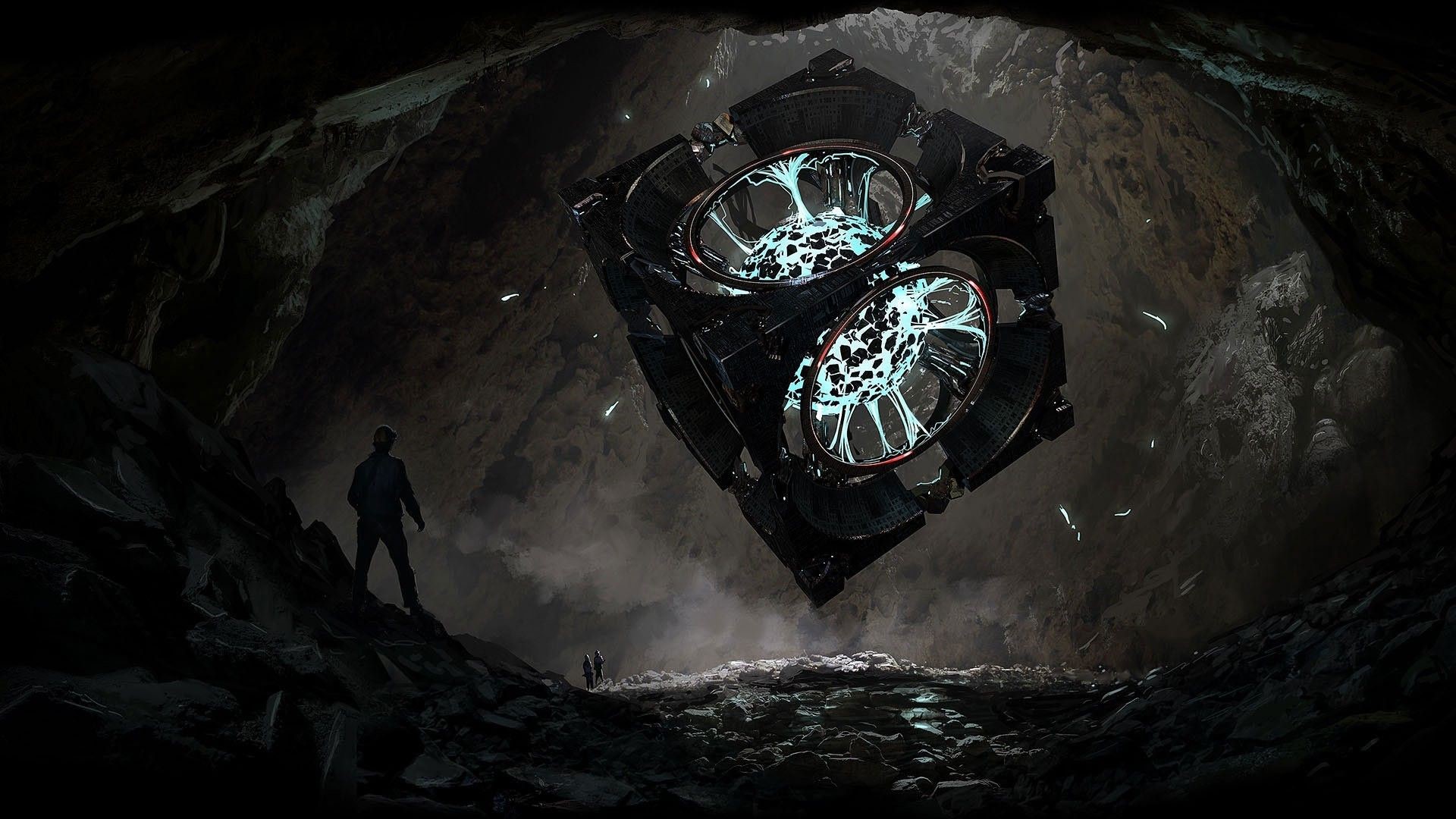 Mysterious cube in a dark cave with explorers HD Wallpaper