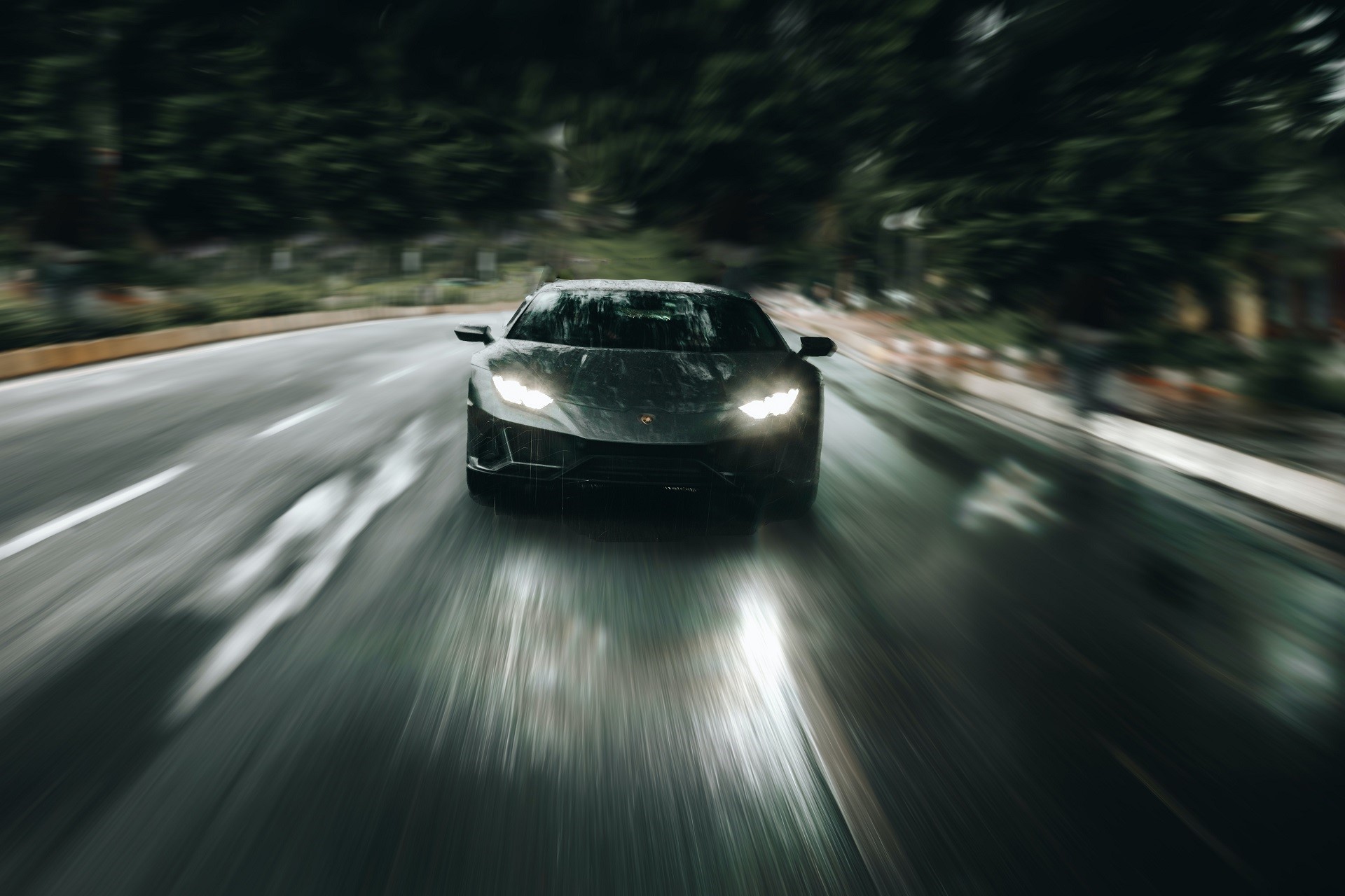 Lamborghini driving on a wet road with motion blur HD Wallpaper