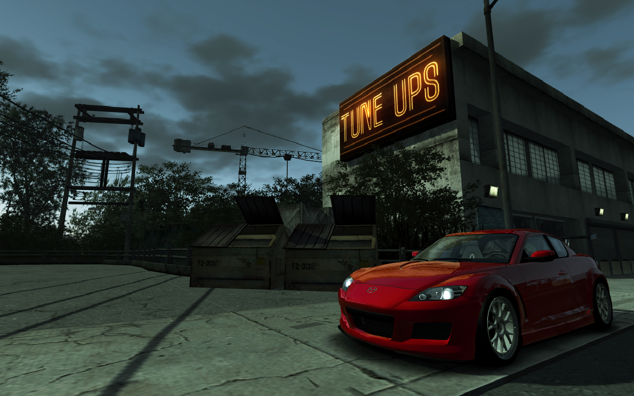 Red Mazda RX-8 in front of a "TUNE UPS" sign HD Wallpaper