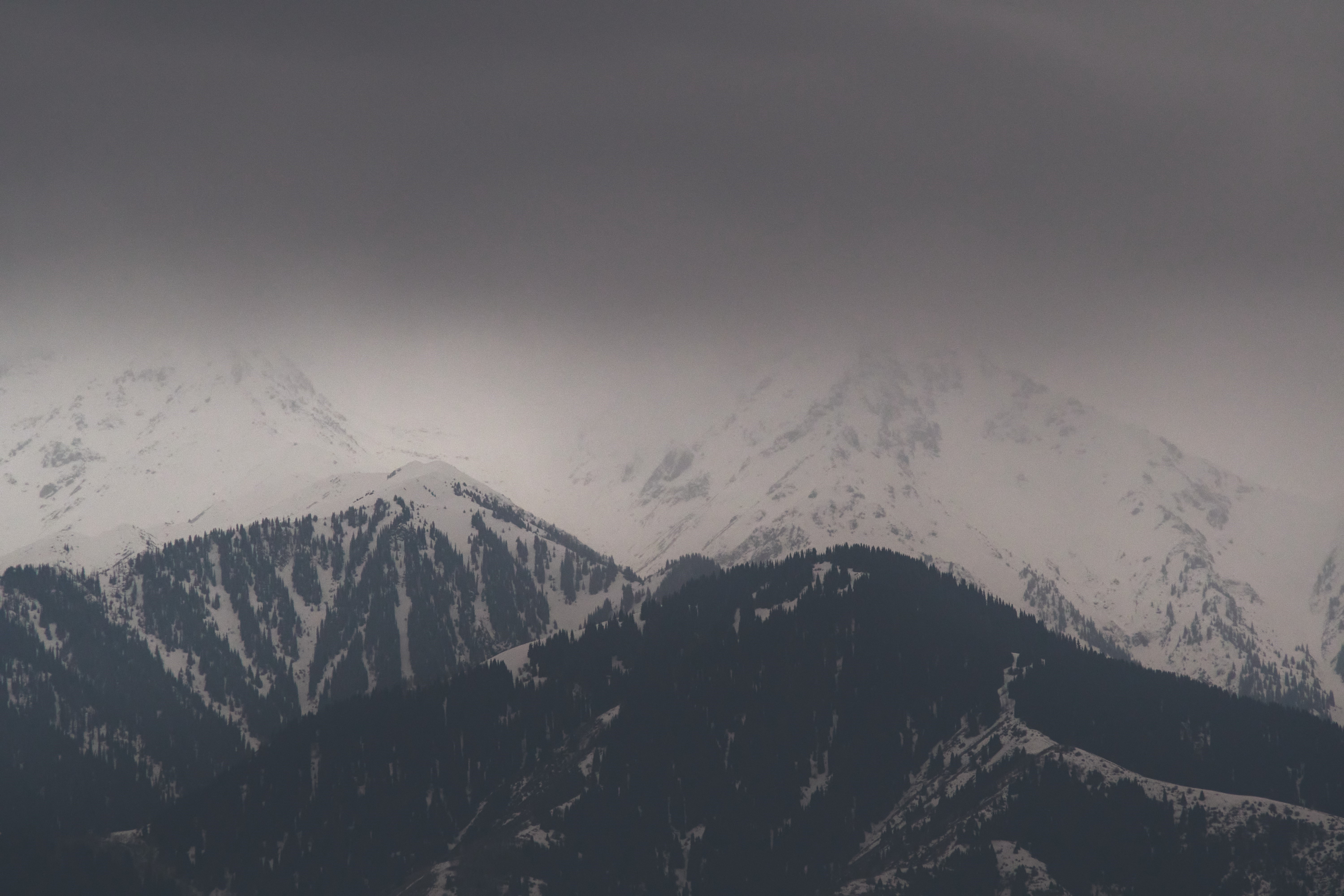 Snowy mountains with mist and clouds HD Wallpaper