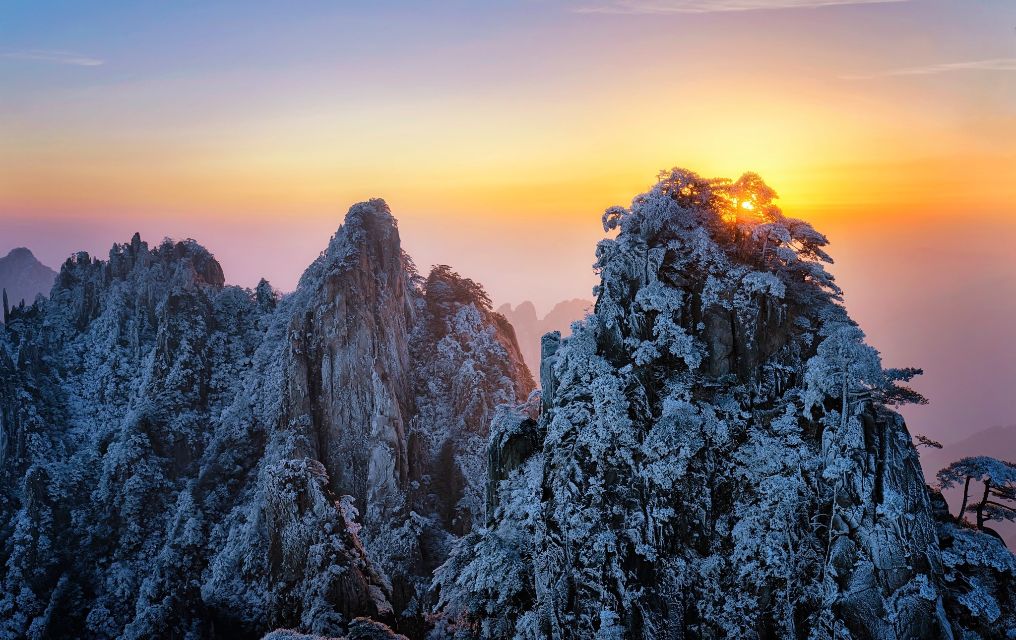 Snow-covered mountains at sunrise HD Wallpaper
