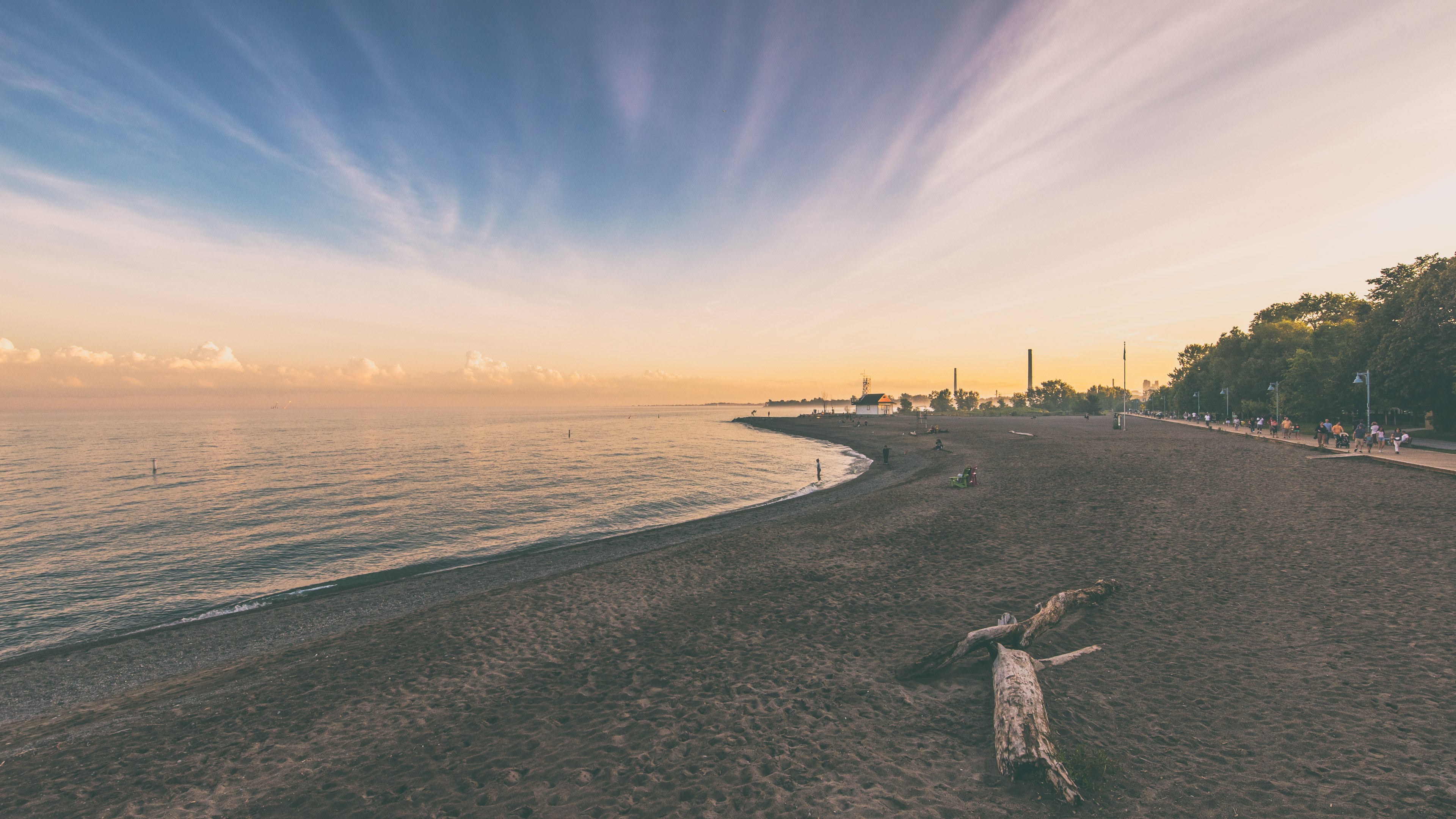 Sunset over Toronto beach with coastline and ocean view HD Wallpaper