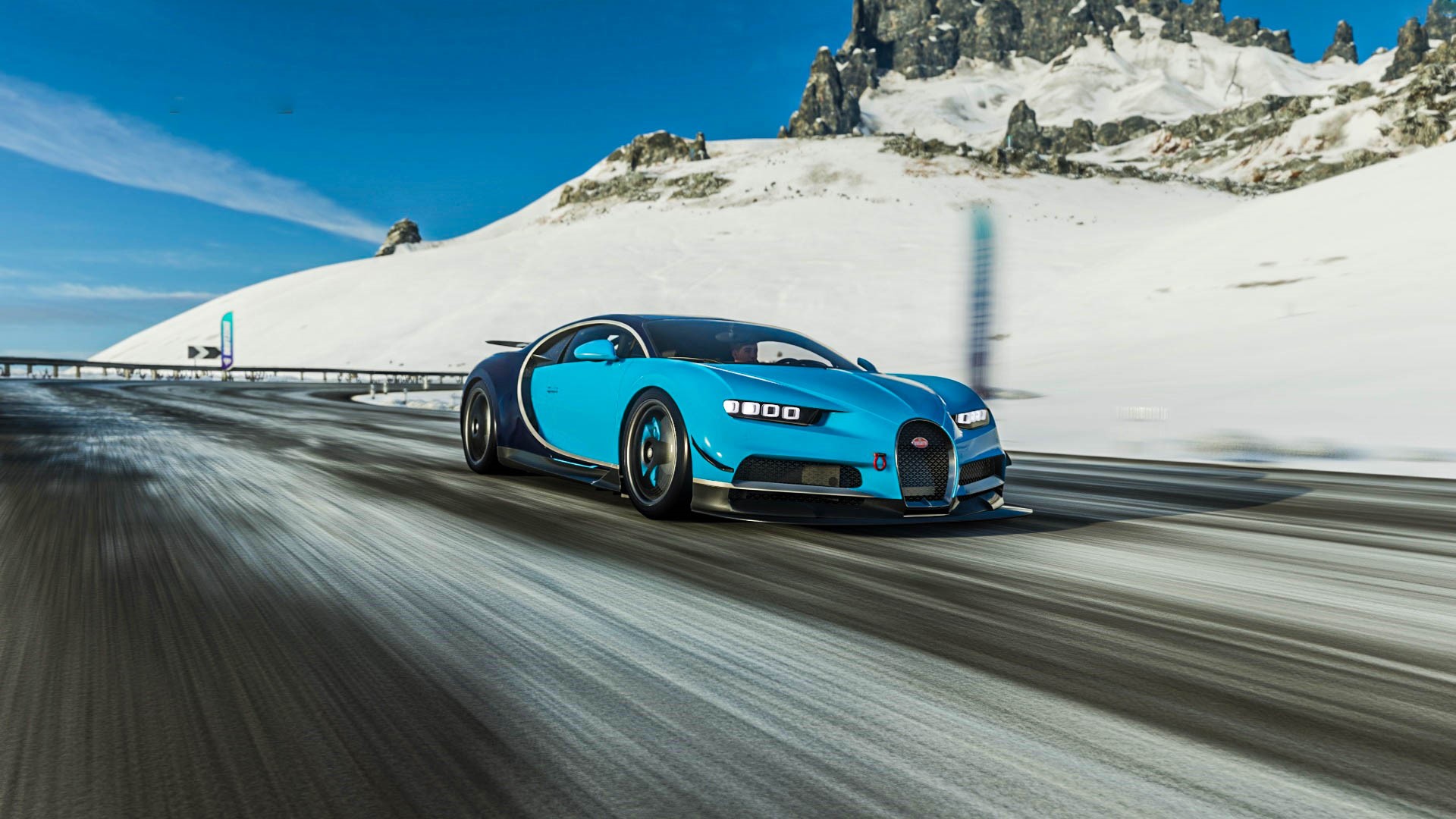 Bugatti Chiron driving on a snowy mountain road HD Wallpaper