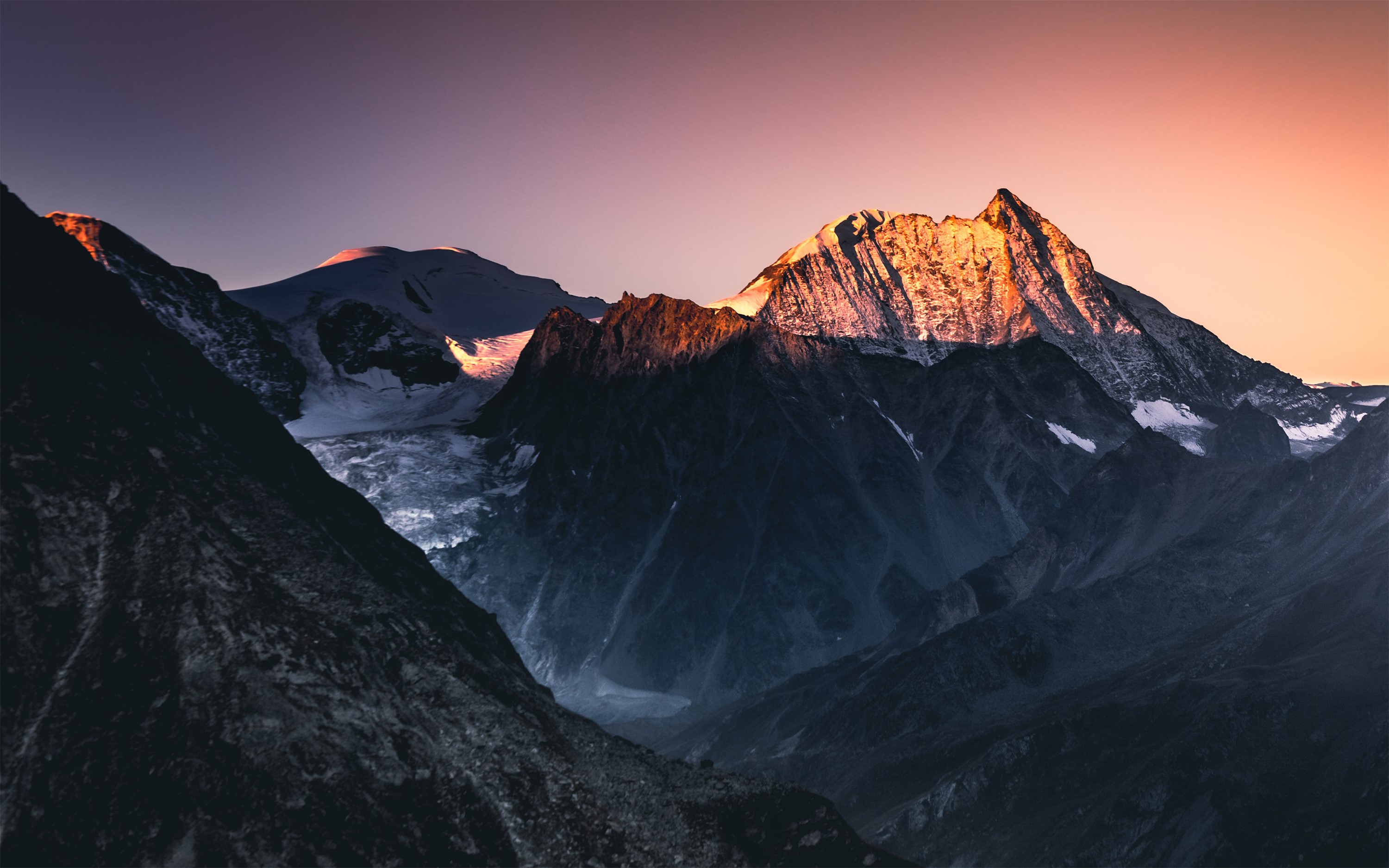 Snow-capped mountains at sunset in Switzerland HD Wallpaper