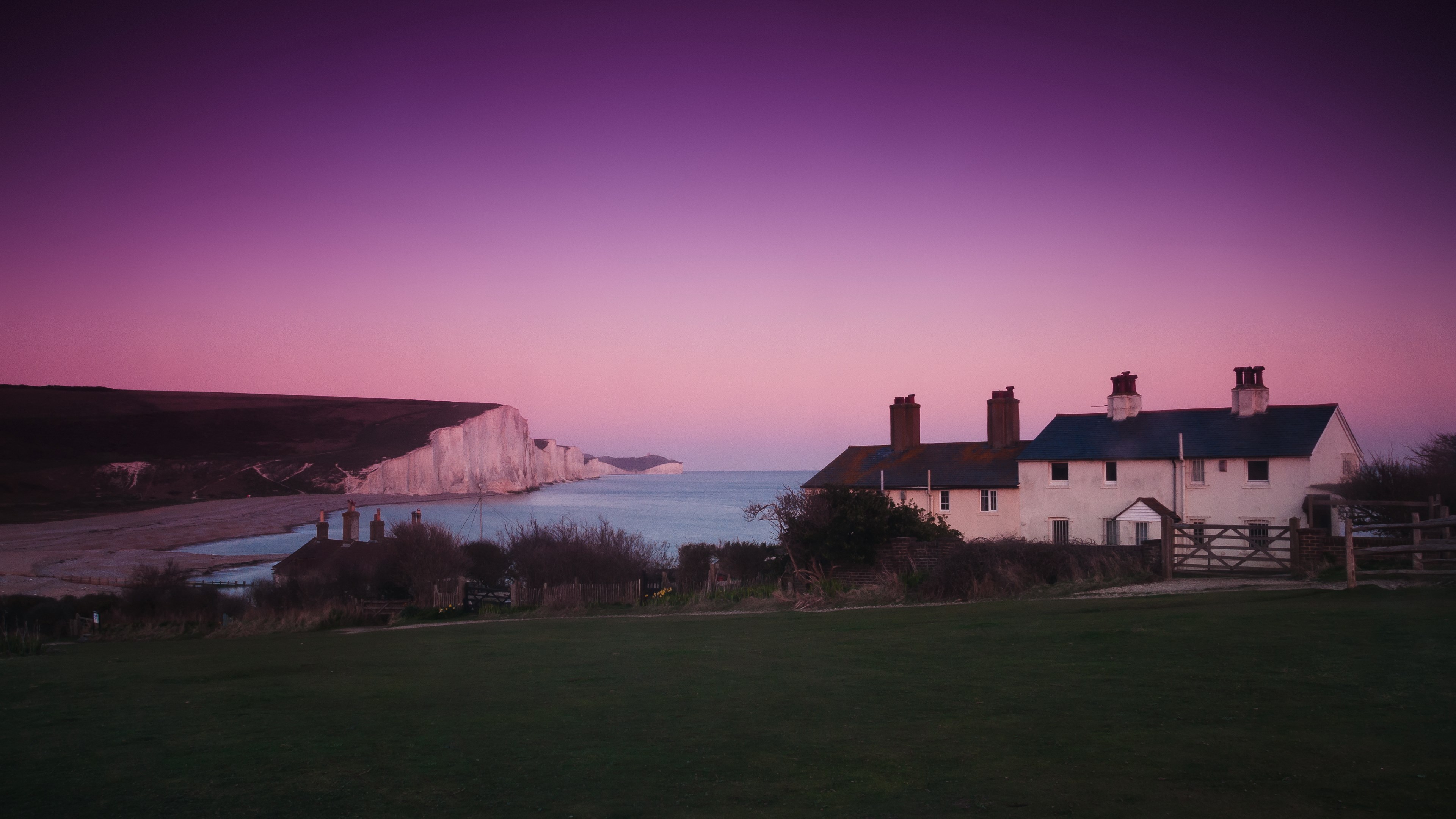 White cottages by the sea at sunset HD Wallpaper