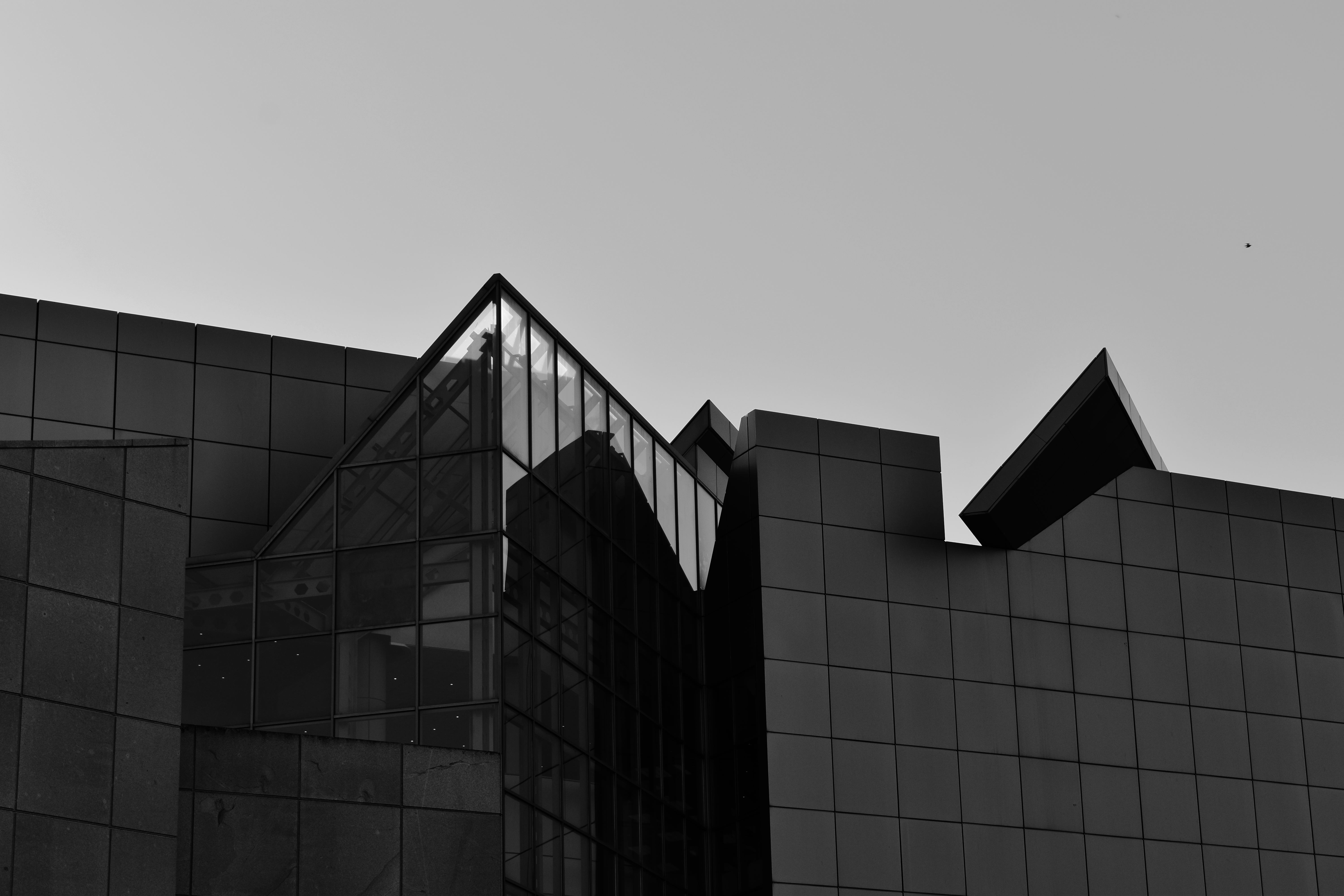 Monochrome architecture of a modern building with glass elements HD Wallpaper