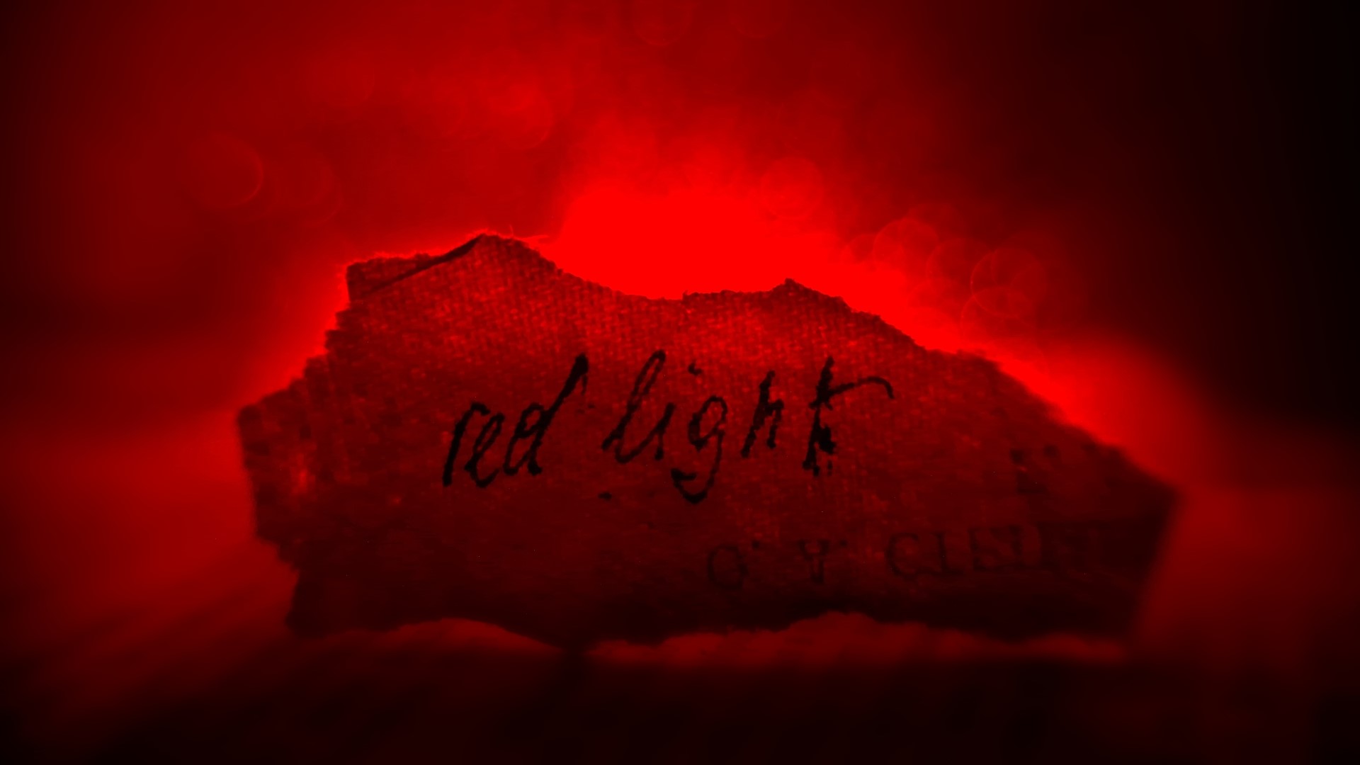 Torn paper with red light and text HD Wallpaper