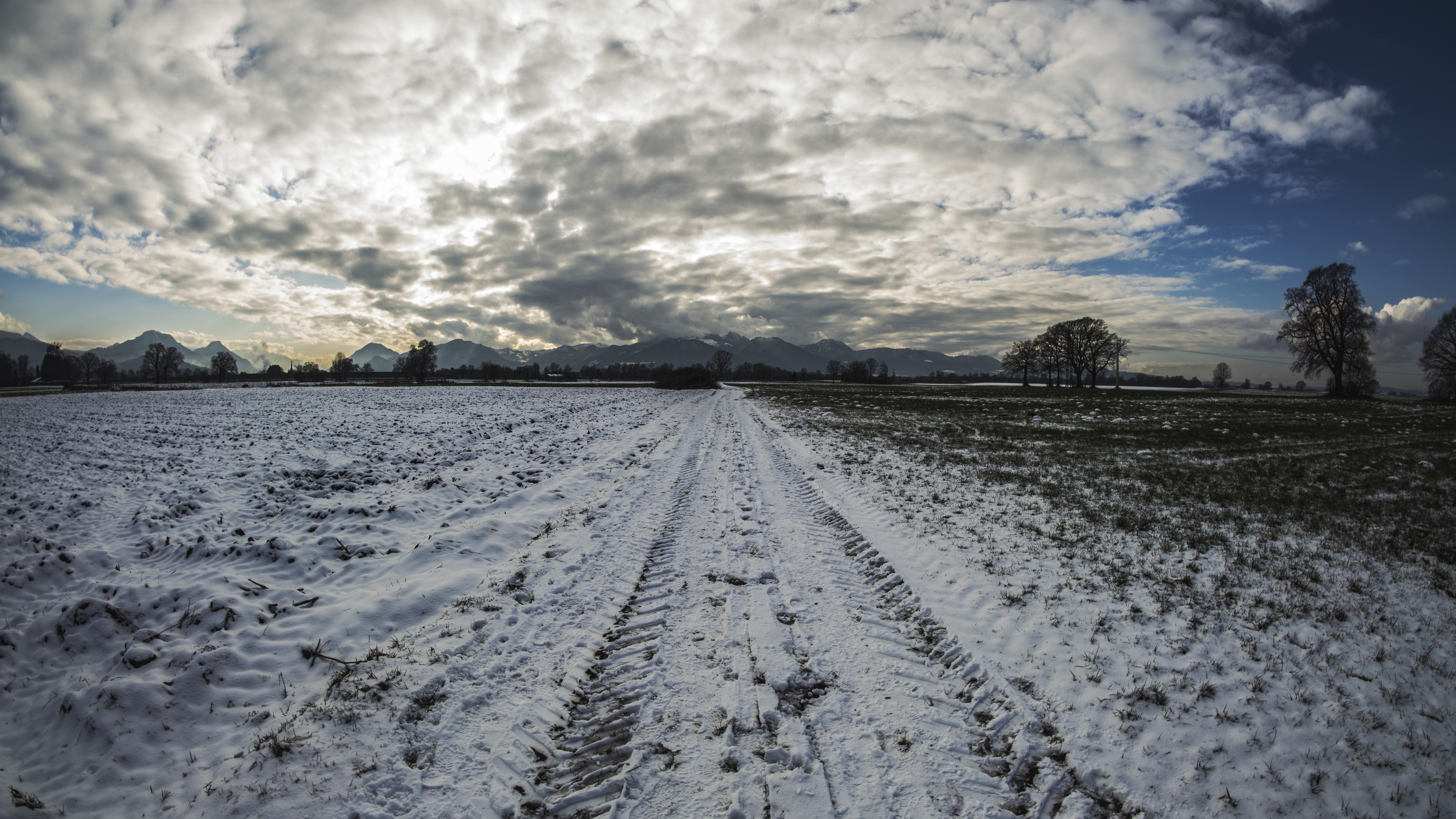 Winter landscape with snow-covered fields and mountains HD Wallpaper
