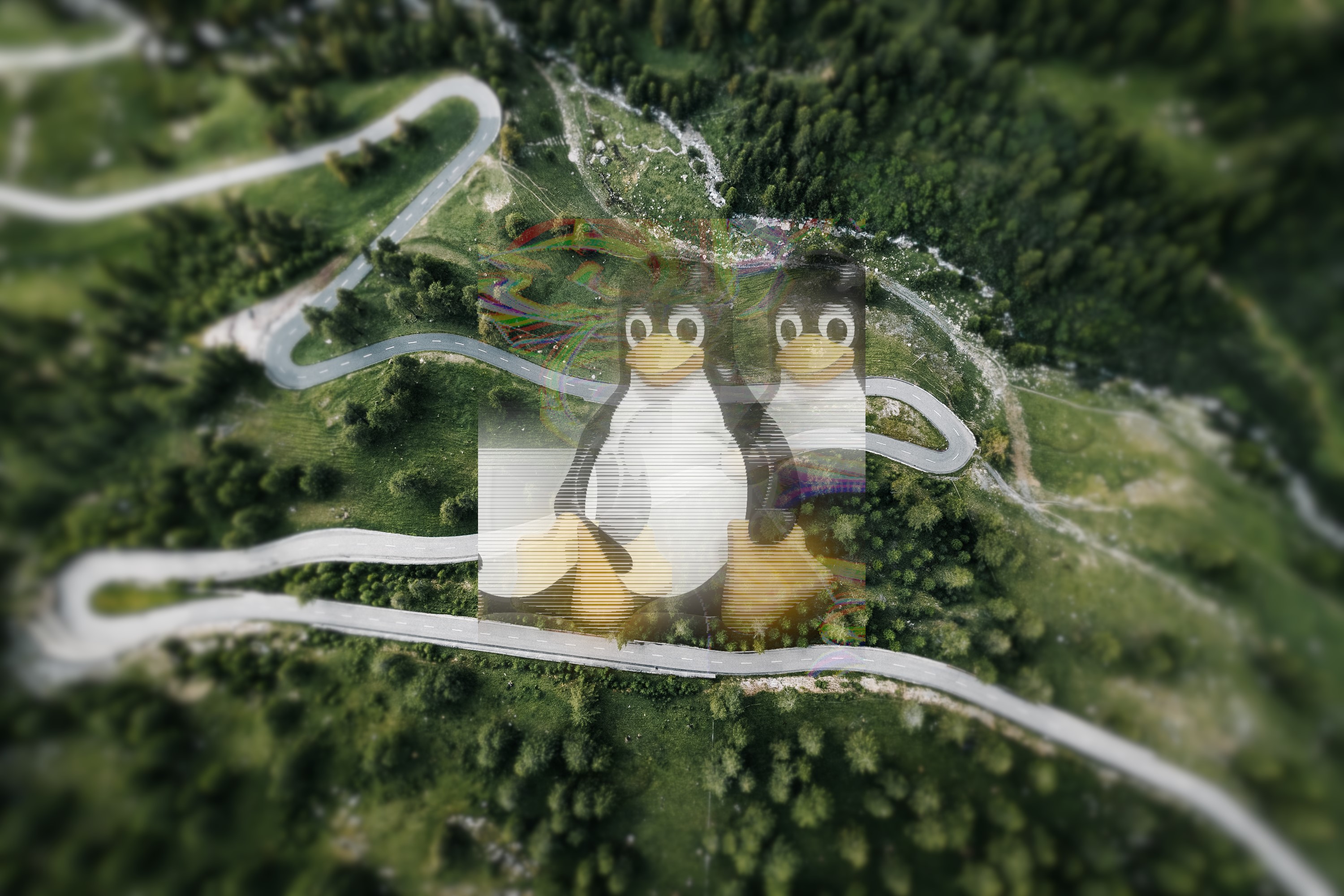 Tux the Linux penguin superimposed on a mountain road HD Wallpaper