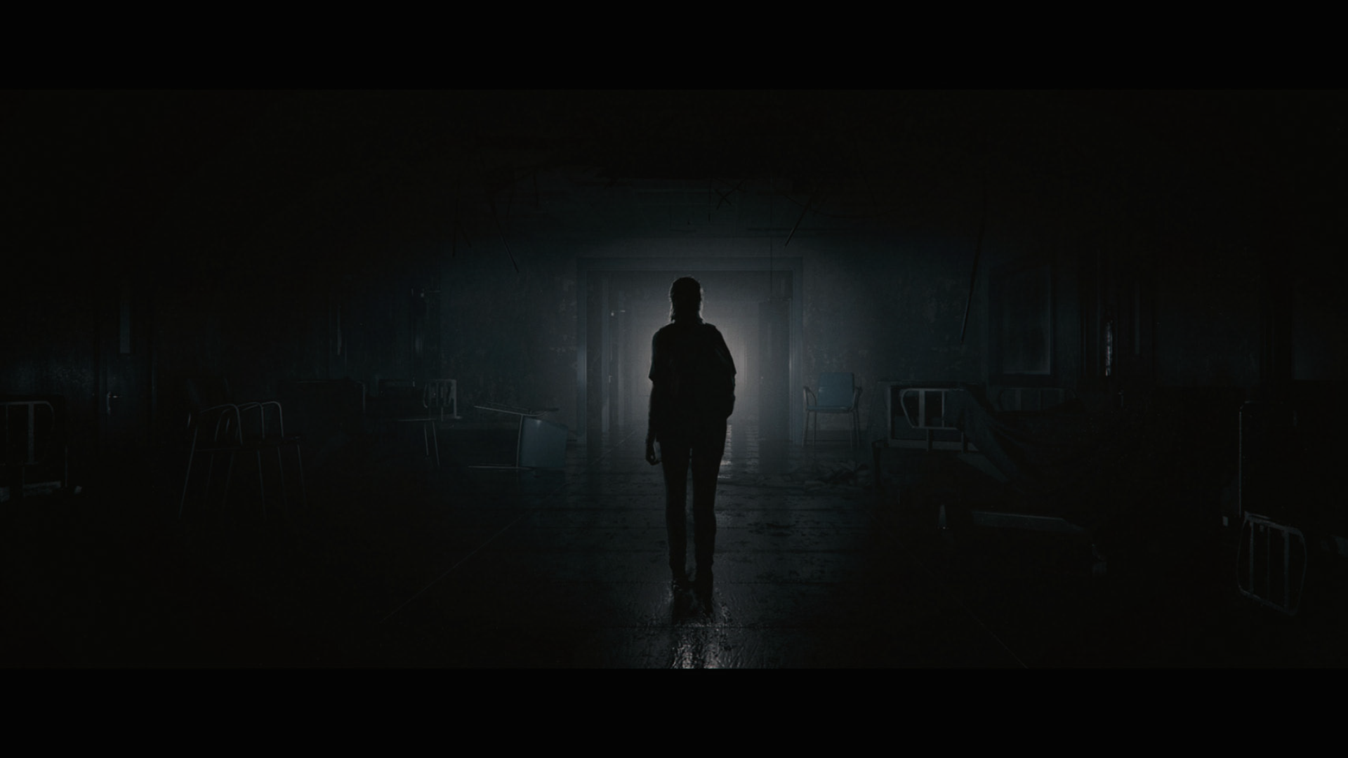 Ellie from The Last of Us Part II in a dark hallway HD Wallpaper
